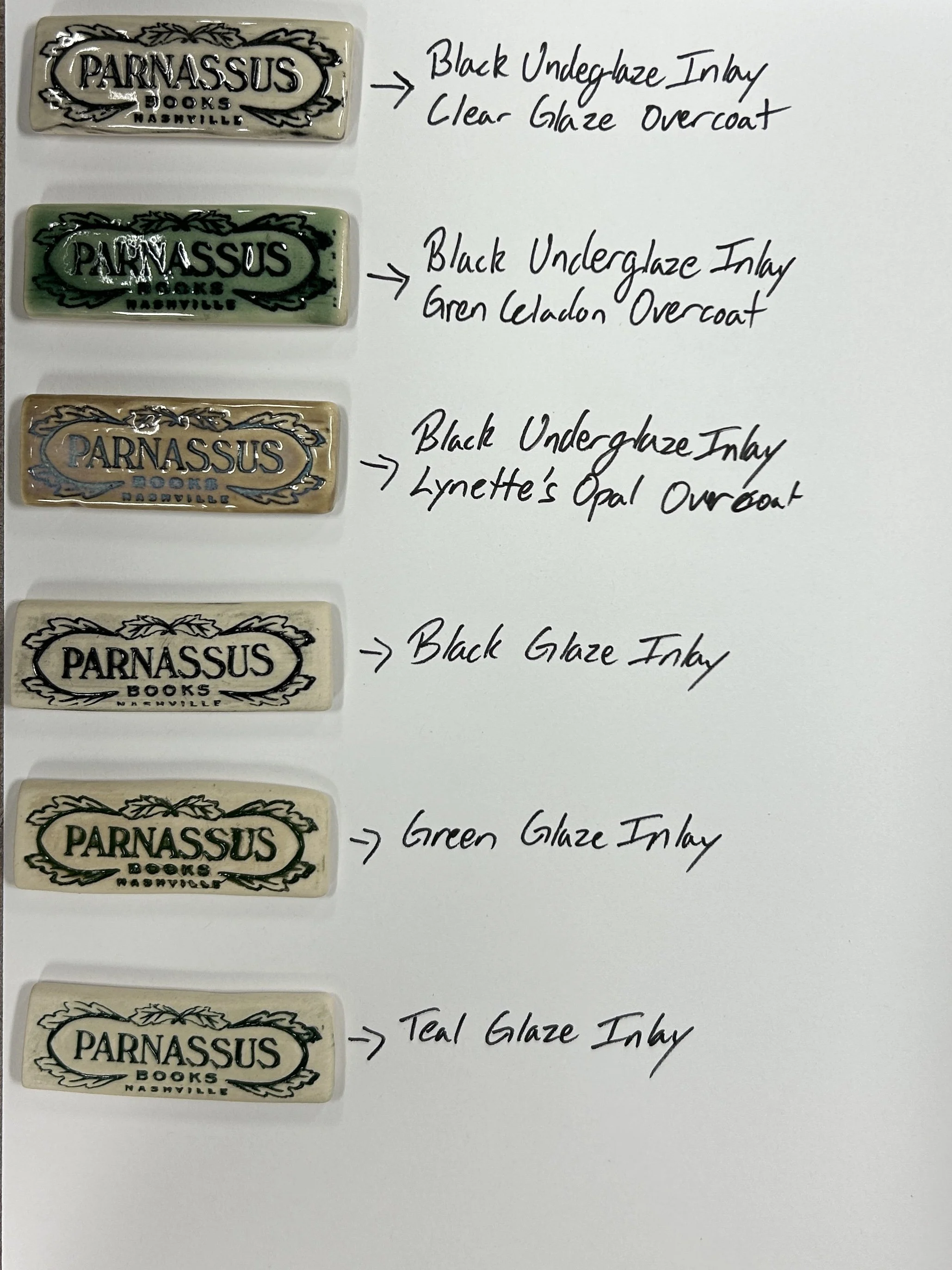 Tests of magnets offered to Parnassus Books. Hand made at Old School Farm Pottery, a nonprofit pottery in Nashville.