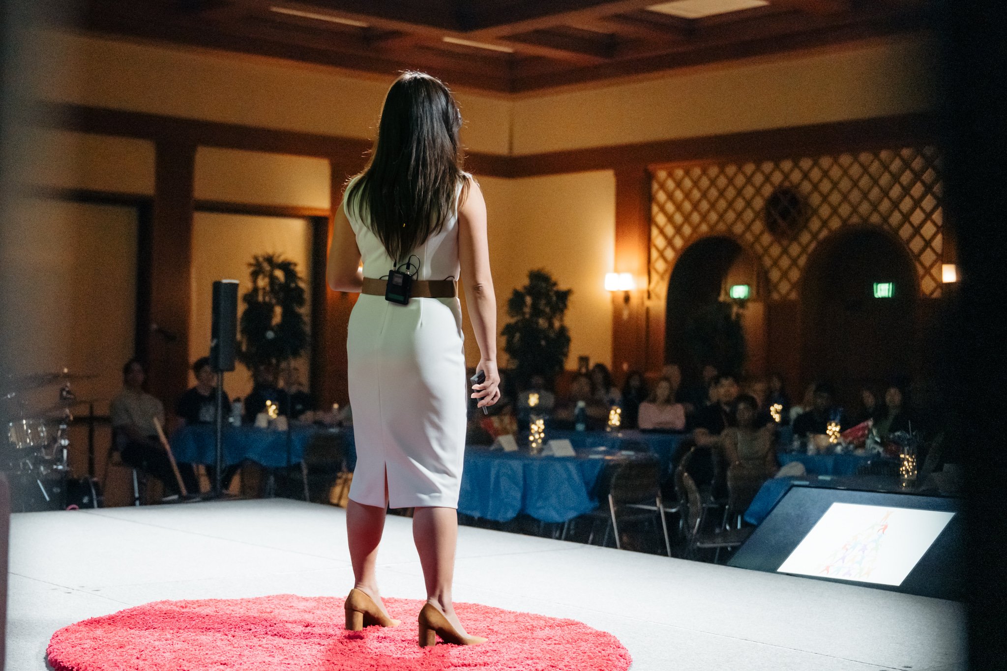 Dr. Nellie Tran speaking to audience at TEDx