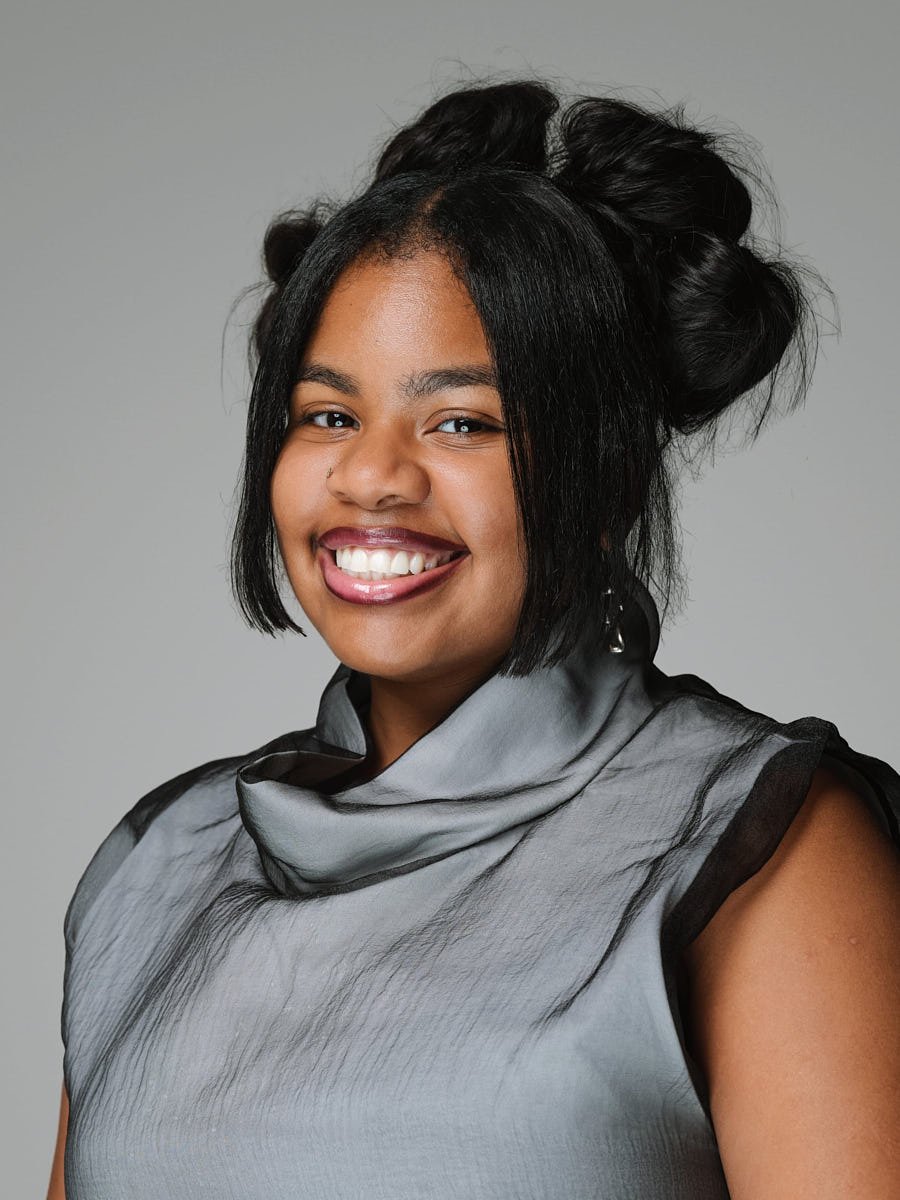 corporate-headshot-nyc-woman-white-sweater-light-background.jpg