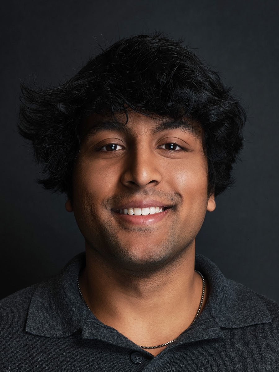 corporate-headshot-nyc-man-dark-polo-dark-background.jpg
