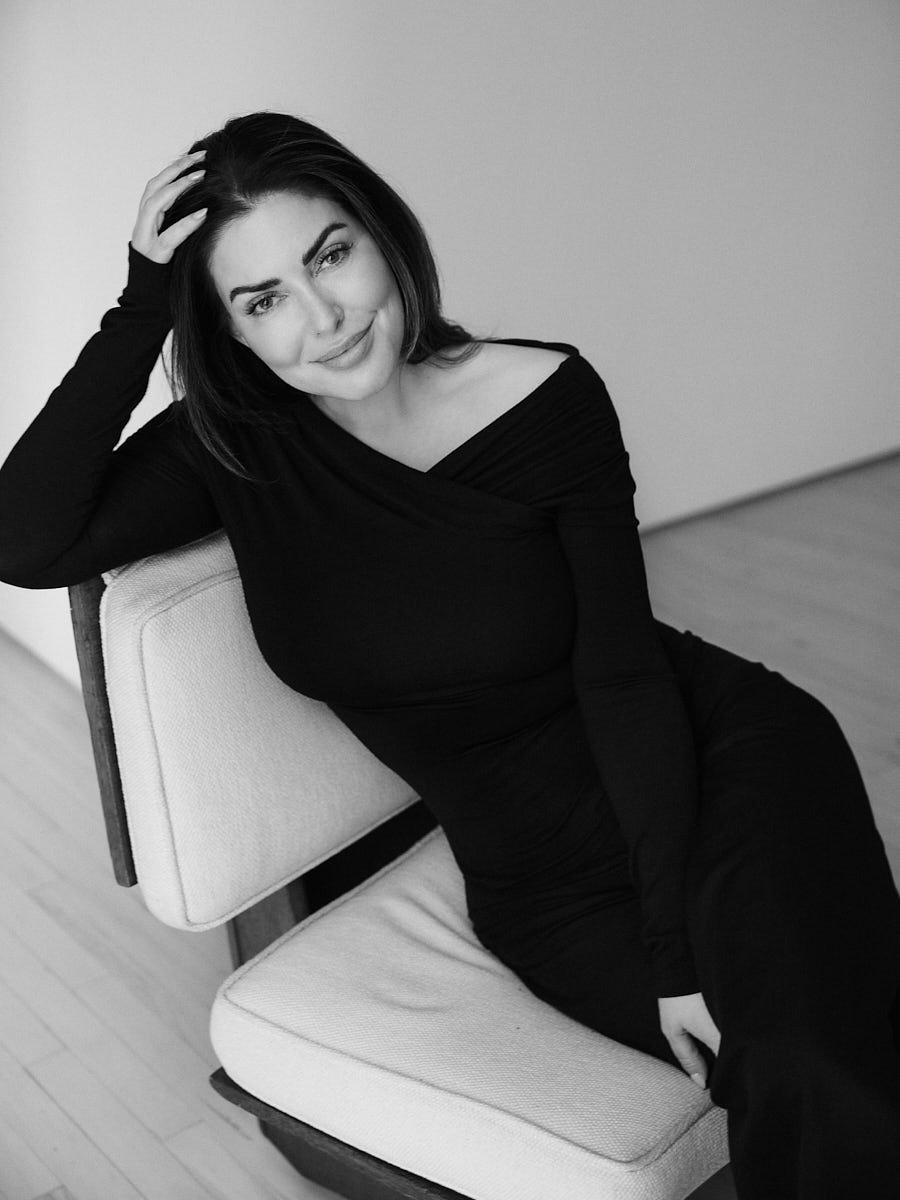personal-branding-photography-nyc-black-and-white-woman-black-dress-seated-chair.jpg