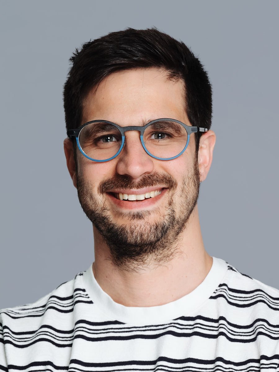 corporate-headshot-nyc-man-striped-shirt-gray-background.jpg