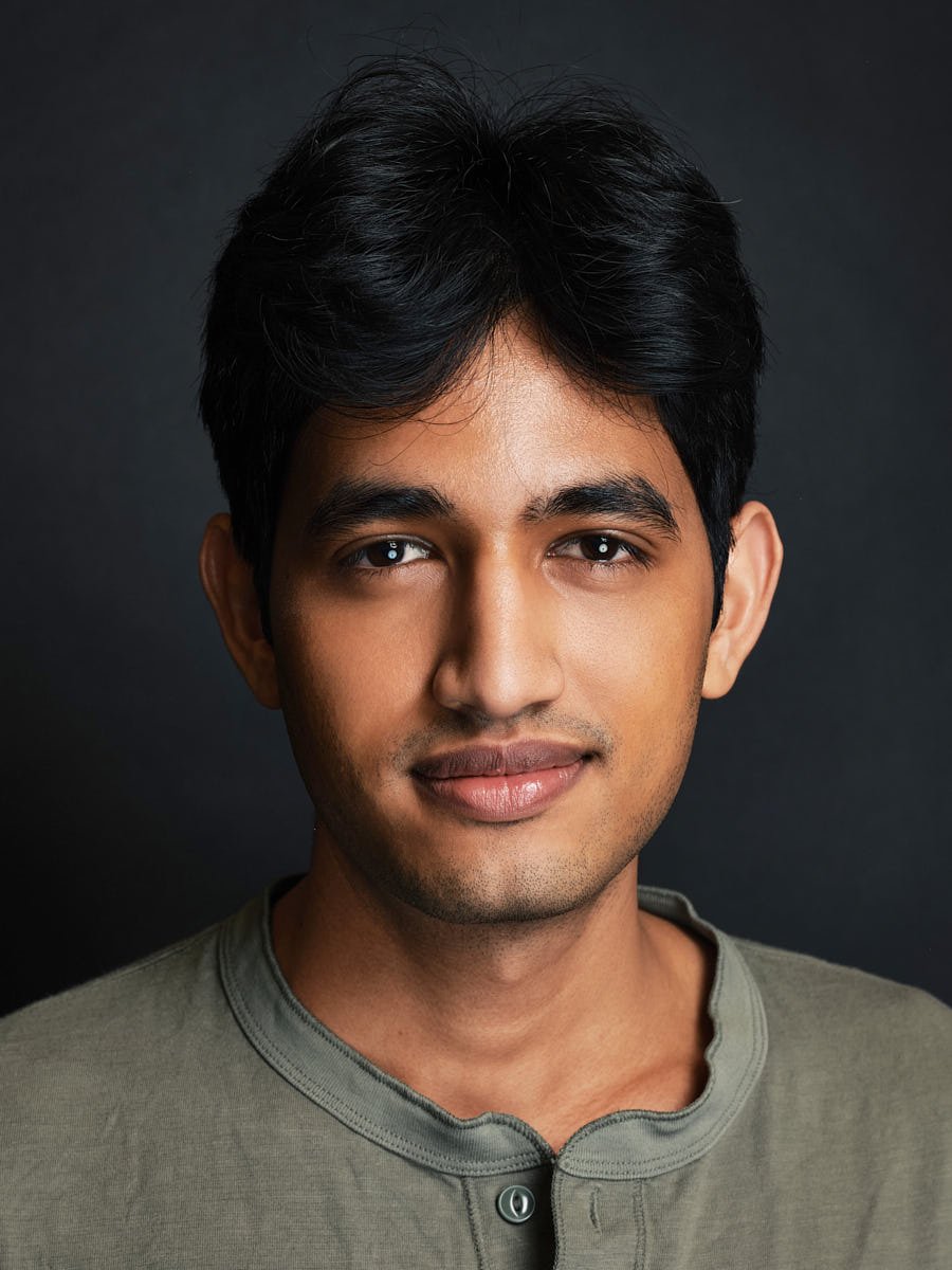 headshots-nyc-man-green-shirt-dark-background.jpg