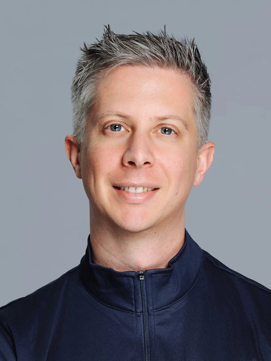 headshots-nyc-man-silver-hair-navy-quarter-zip.jpg