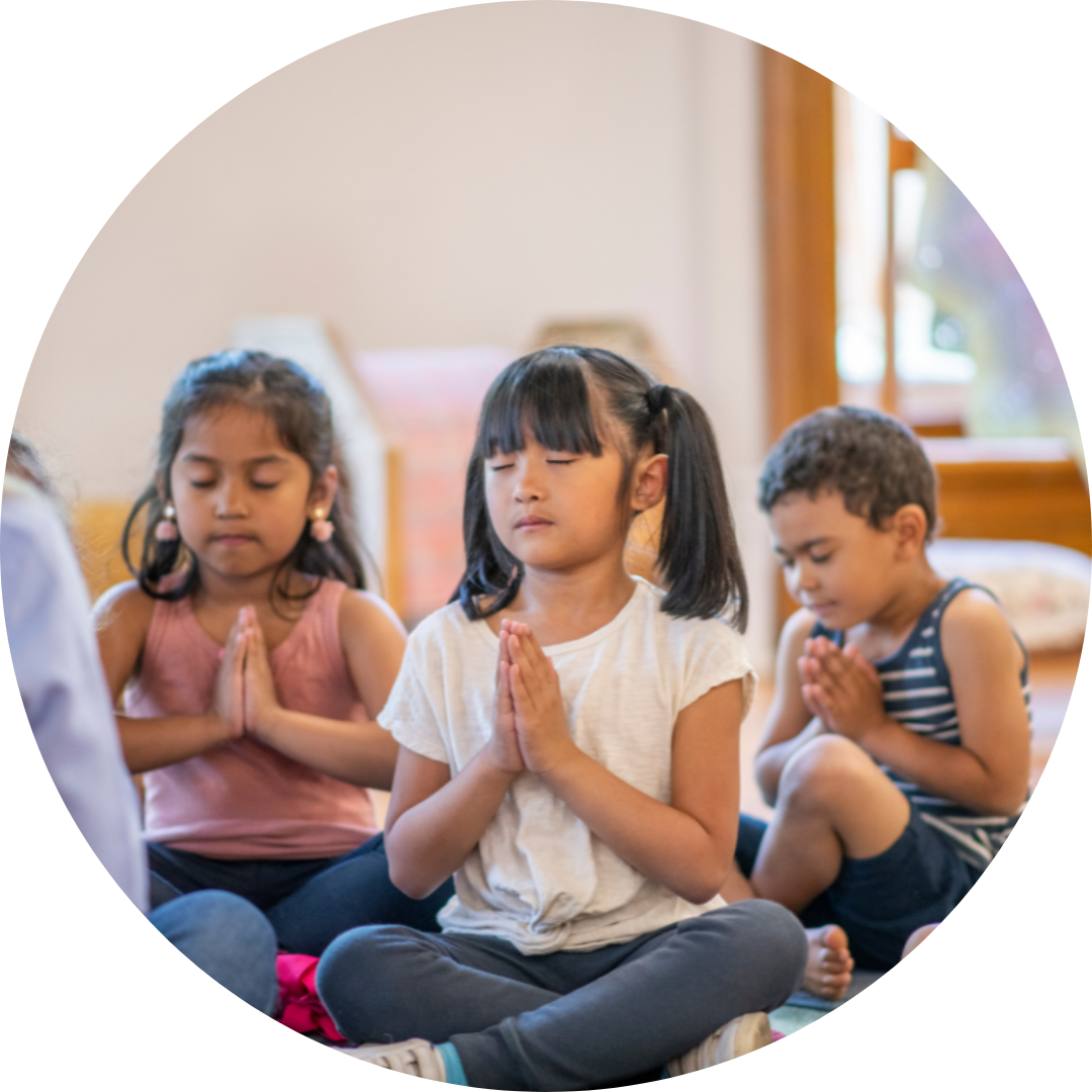 children sitting in meditation