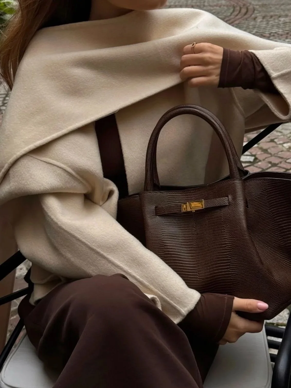 Kate Hutchins modelling Demellier London's leather handbag for influencer campaign