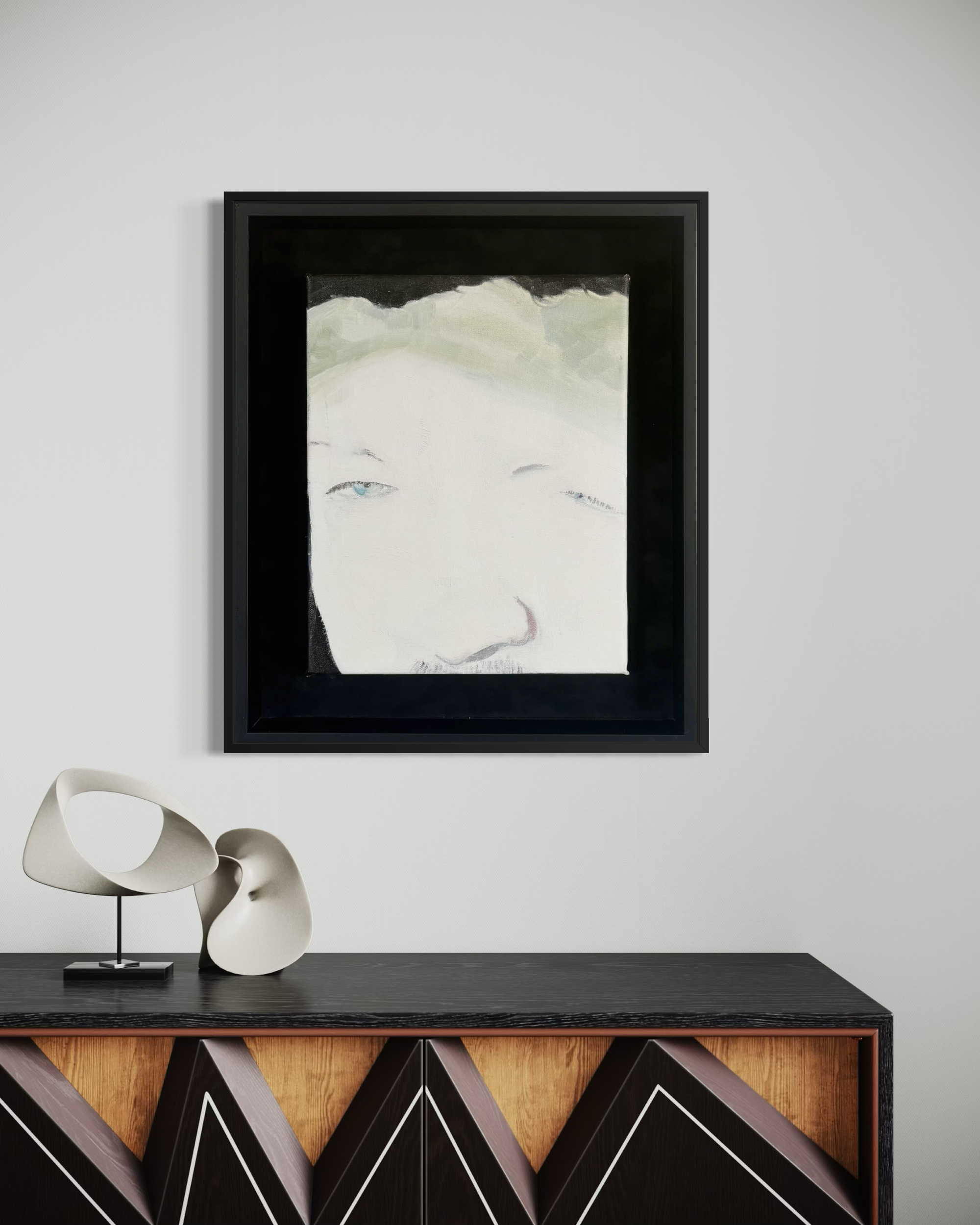 Wake presents a disembodied self-portrait defined by a single, piercing blue eye. Emerging from darkness, the fragmented form conveys both fragility and resilience