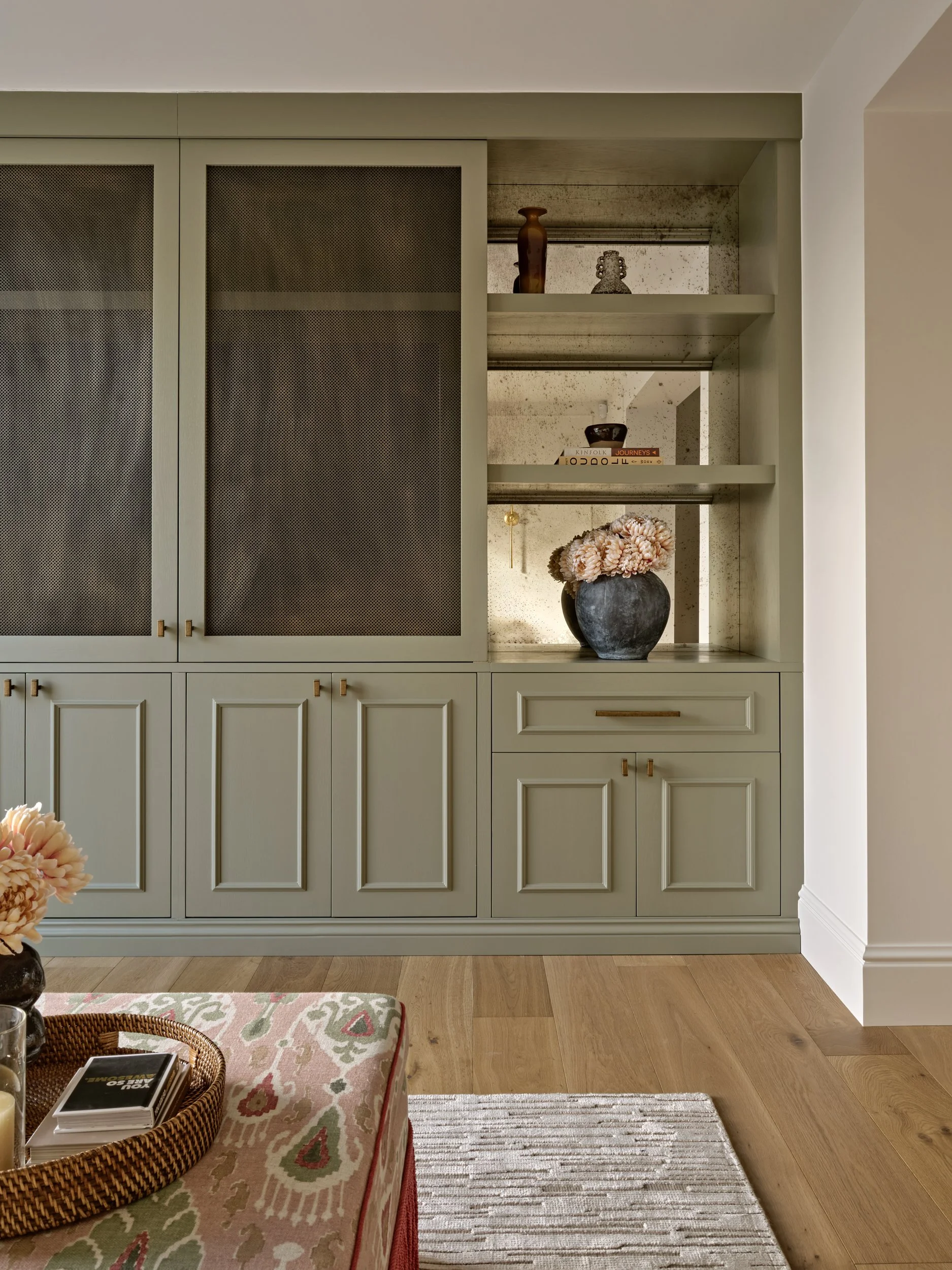 Hidden television revealed within bespoke cabinet, Surrey home.jpeg