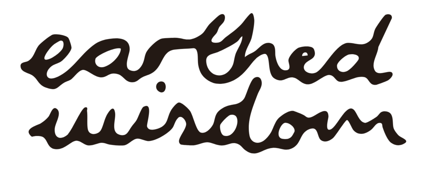 Handwritten words saying 'earthed wisdom' in black cursive font