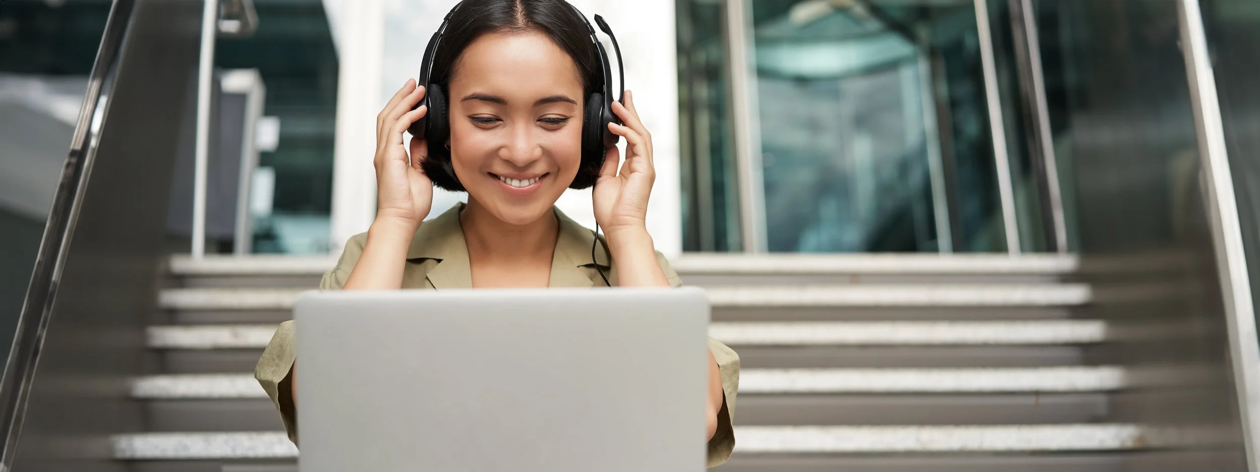 portrait-young-asian-woman-sitting-with-laptop-headphones-watching-video-does-online-course.jpg