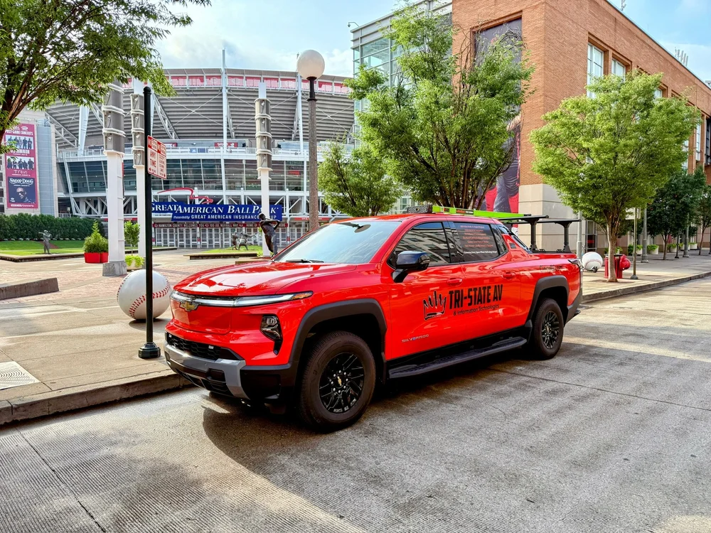 Red Tri-State AV pickup truck parked near Great American Ball Park in downtown Cincinnati