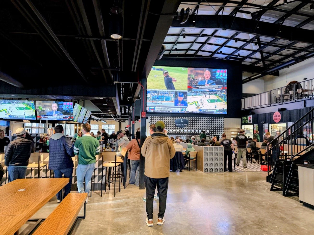 Crowd at Westfield Collective watching games on the LED wall and TVs installed by Tri-State AV
