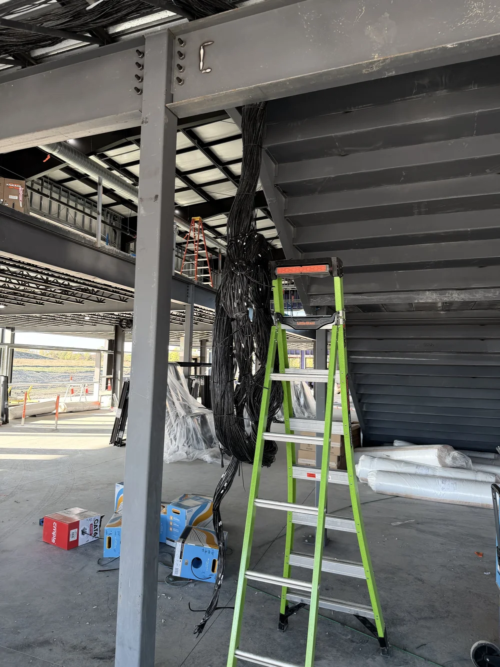 Tri-State AV technician installing network infrastructure at Westfield Collective