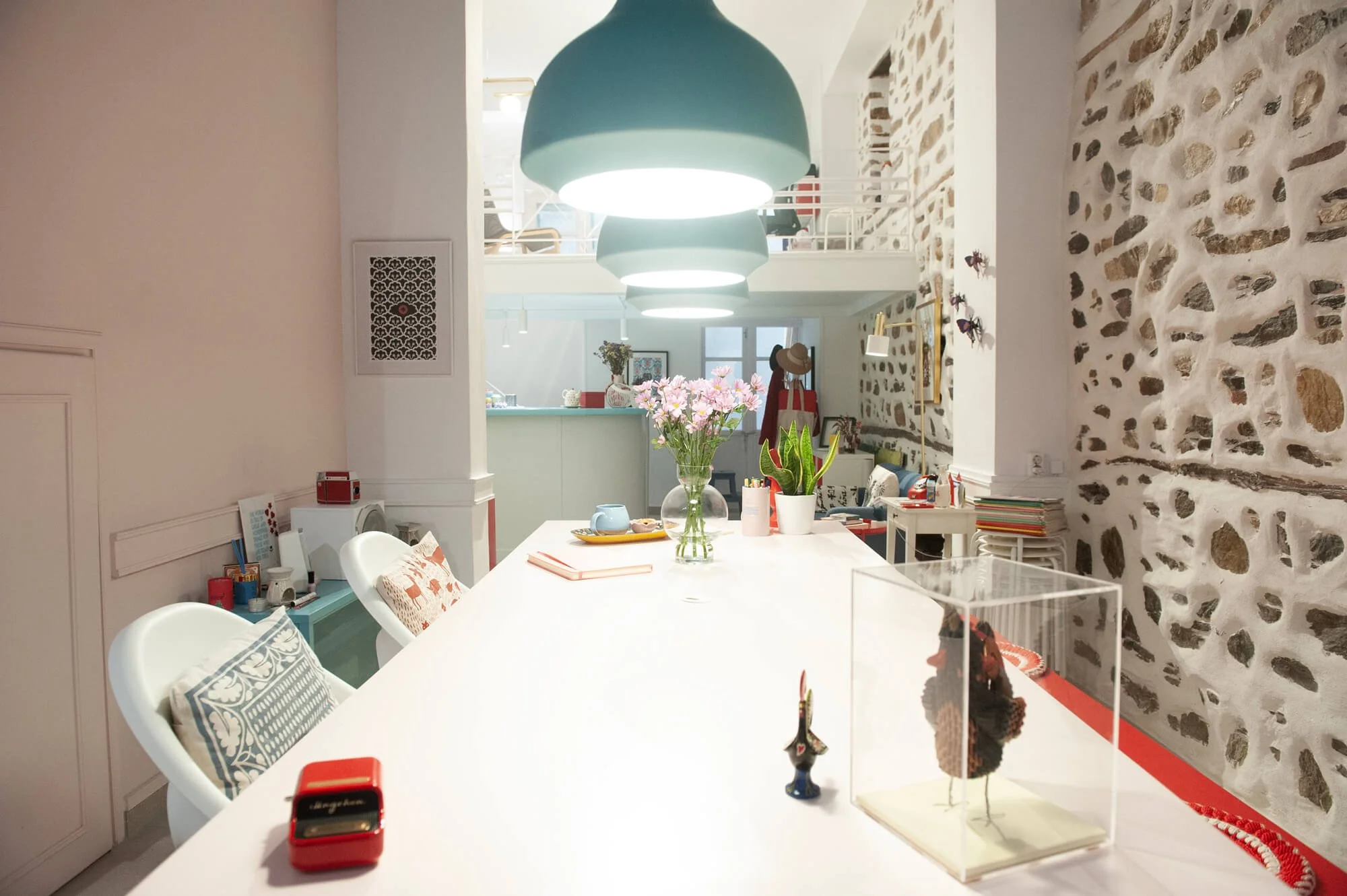 Until Sunday Studio: inside view of the big pink table and the kitchenette.