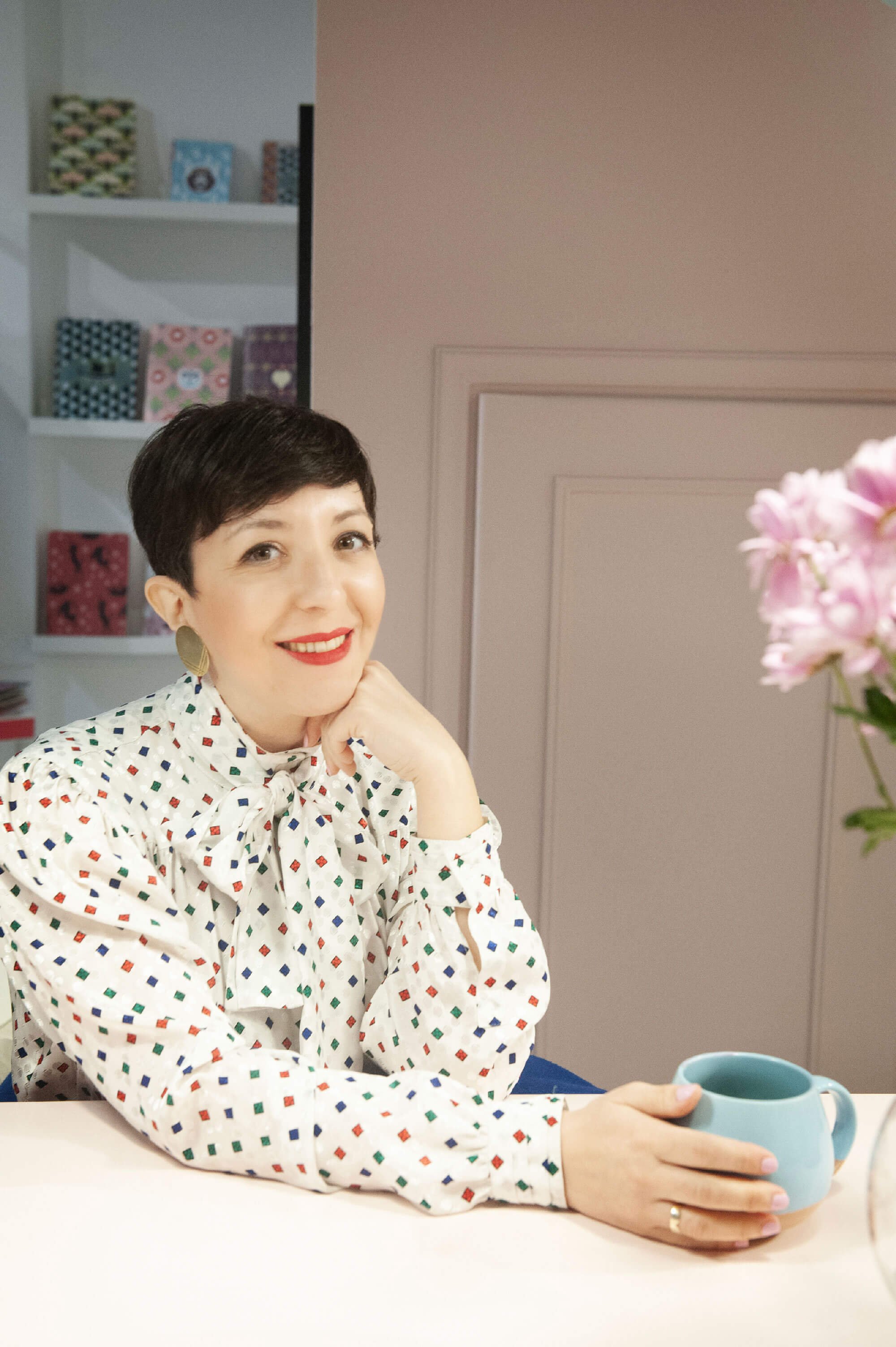 Chiara Aliotta is sitting in her office. Smiling at the camera.