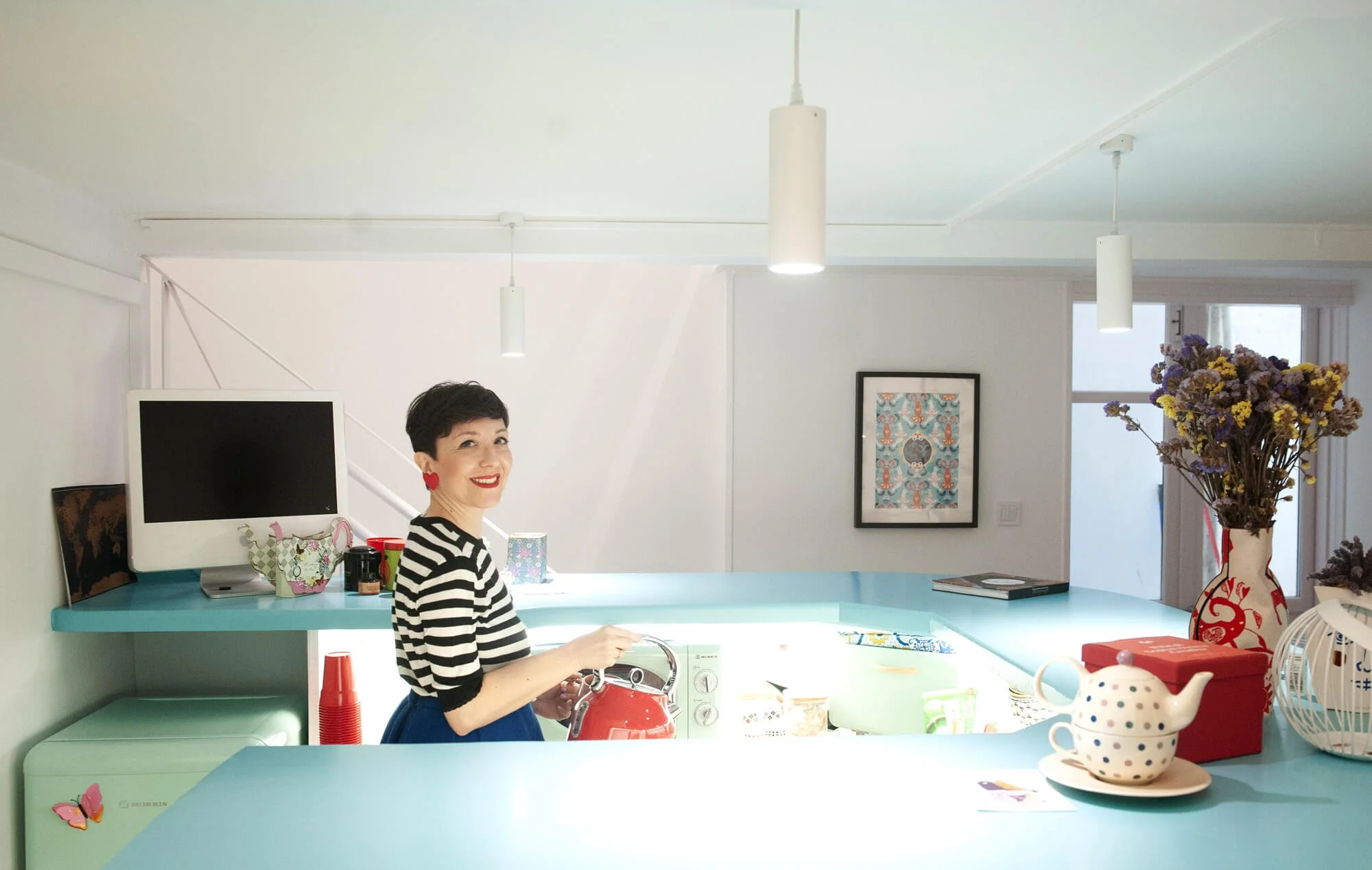 Chiara Aliotta preparing tea in her studio's kitchen