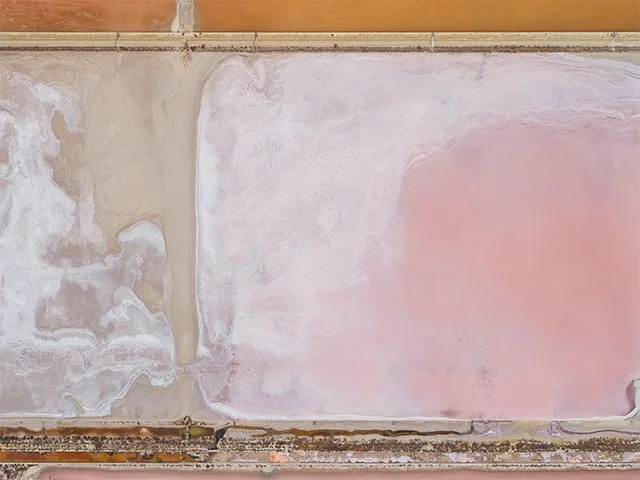 An abstract painting featuring cream, white, pink and orange colors.