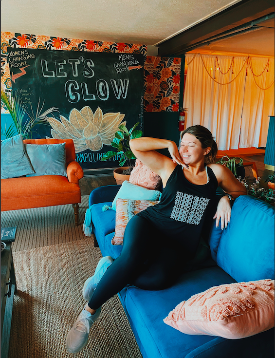 owner of StudiOH Scoop posing in a studio glow tank top