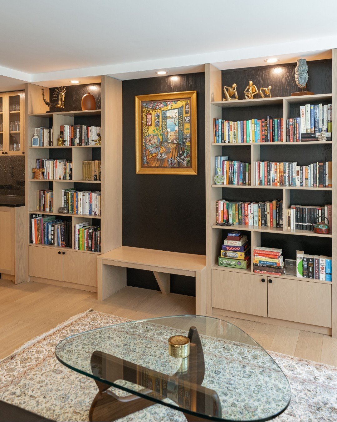 Tomorrow is World Book Day! 🌍📚✨

To celebrate let&rsquo;s remember the beautiful custom millwork unit we designed for our clients collection of books, art and sentimental items. We love how the white oak modular shelving with black stained backing 