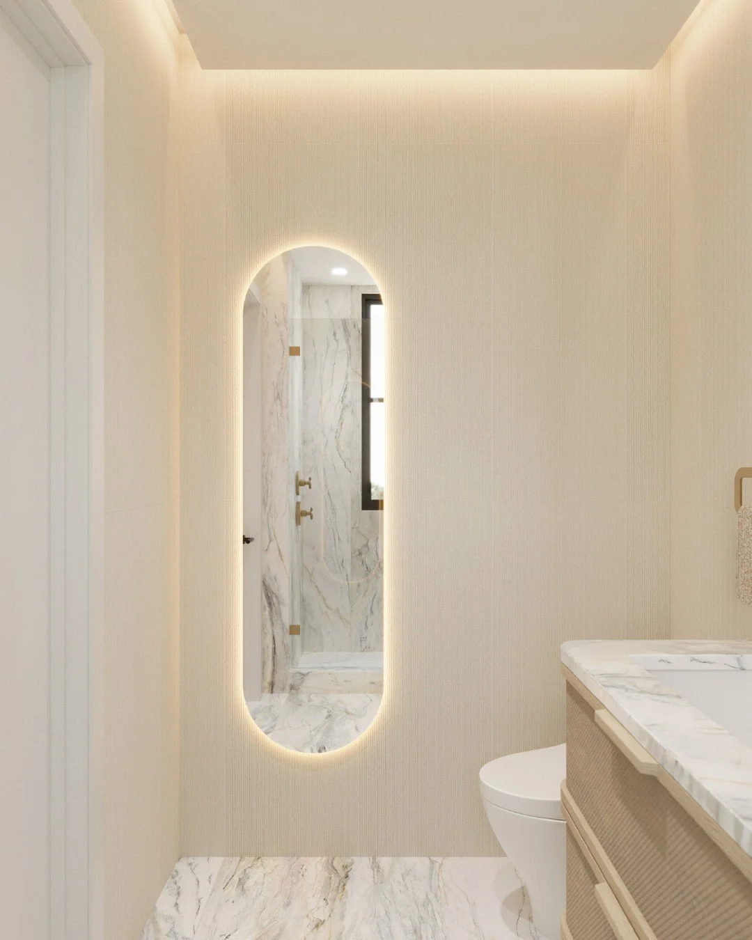 An arched backlit mirror in this primary bathroom design becomes a sculptural focal point, reflecting layers of marble, warm wood, and soft ambient light. A serene balance of form and function, crafted to make every moment feel like a retreat.

Becau