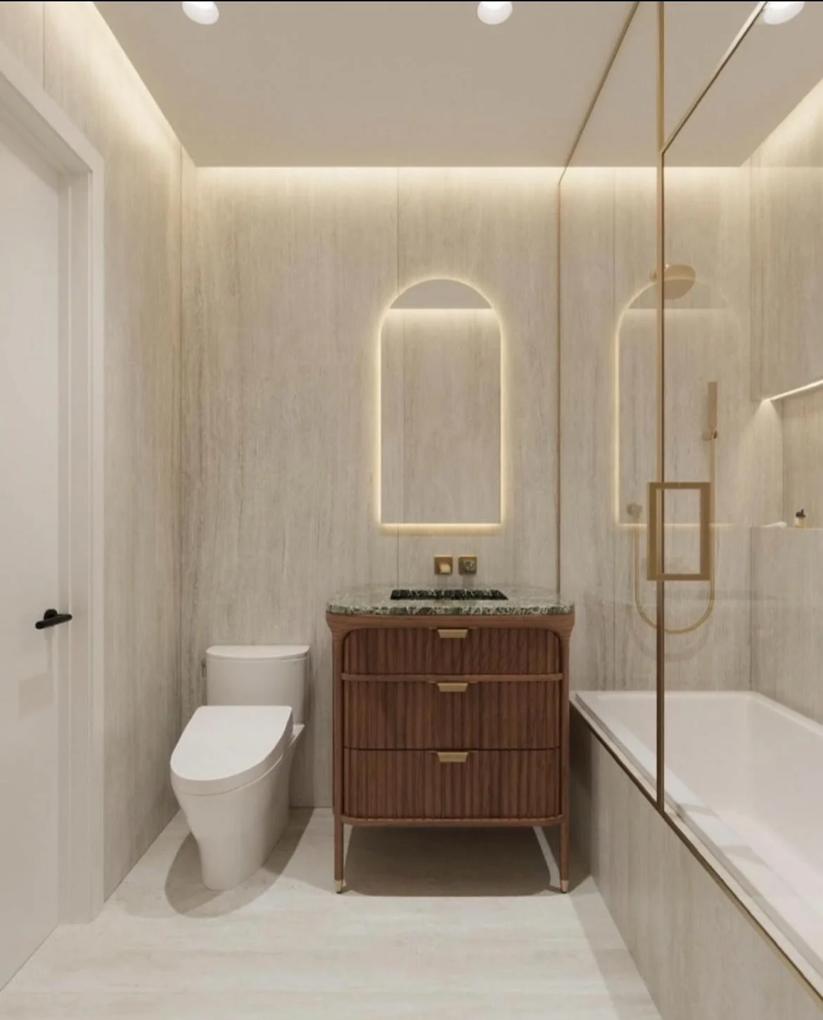 A guest bath that feels anything but secondary ✨

Warm stone, brushed brass, and rich wood tones set the stage for a stunning green stone vanity top &mdash; a subtle yet striking detail that ties this space to the rest of the home. Throughout the des
