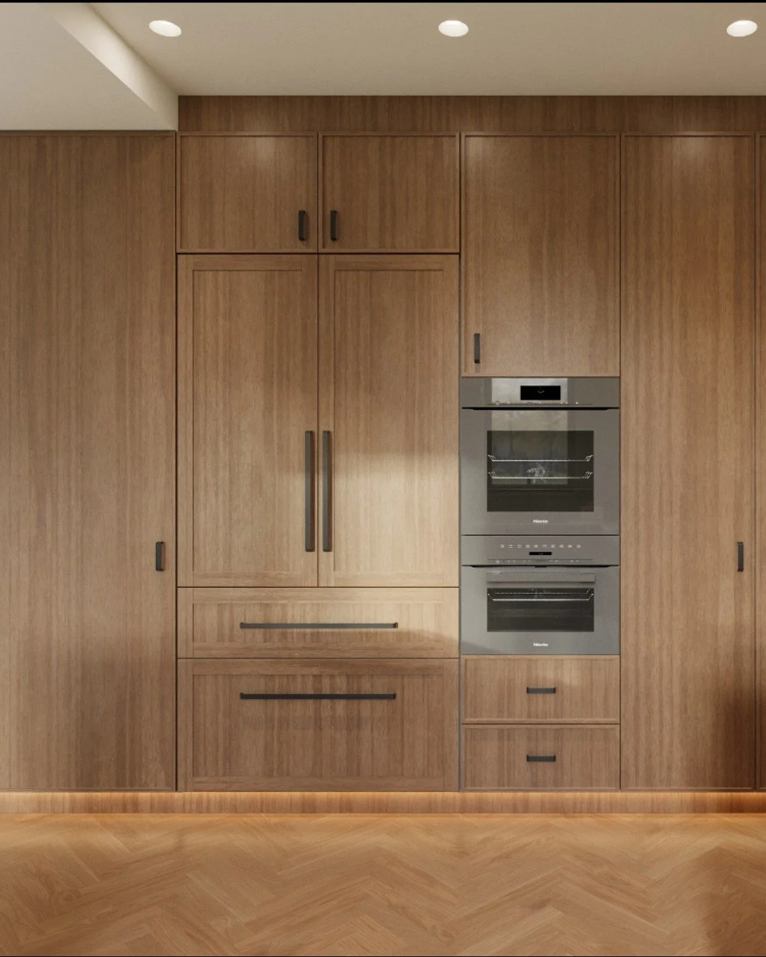 A fully integrated wall that does it ALL! ✨

Rich dark walnut cabinetry runs floor to ceiling, offering storage for days while keeping the refrigerator completely concealed for a clean, uninterrupted look. The graphite glass oven and speed oven blend