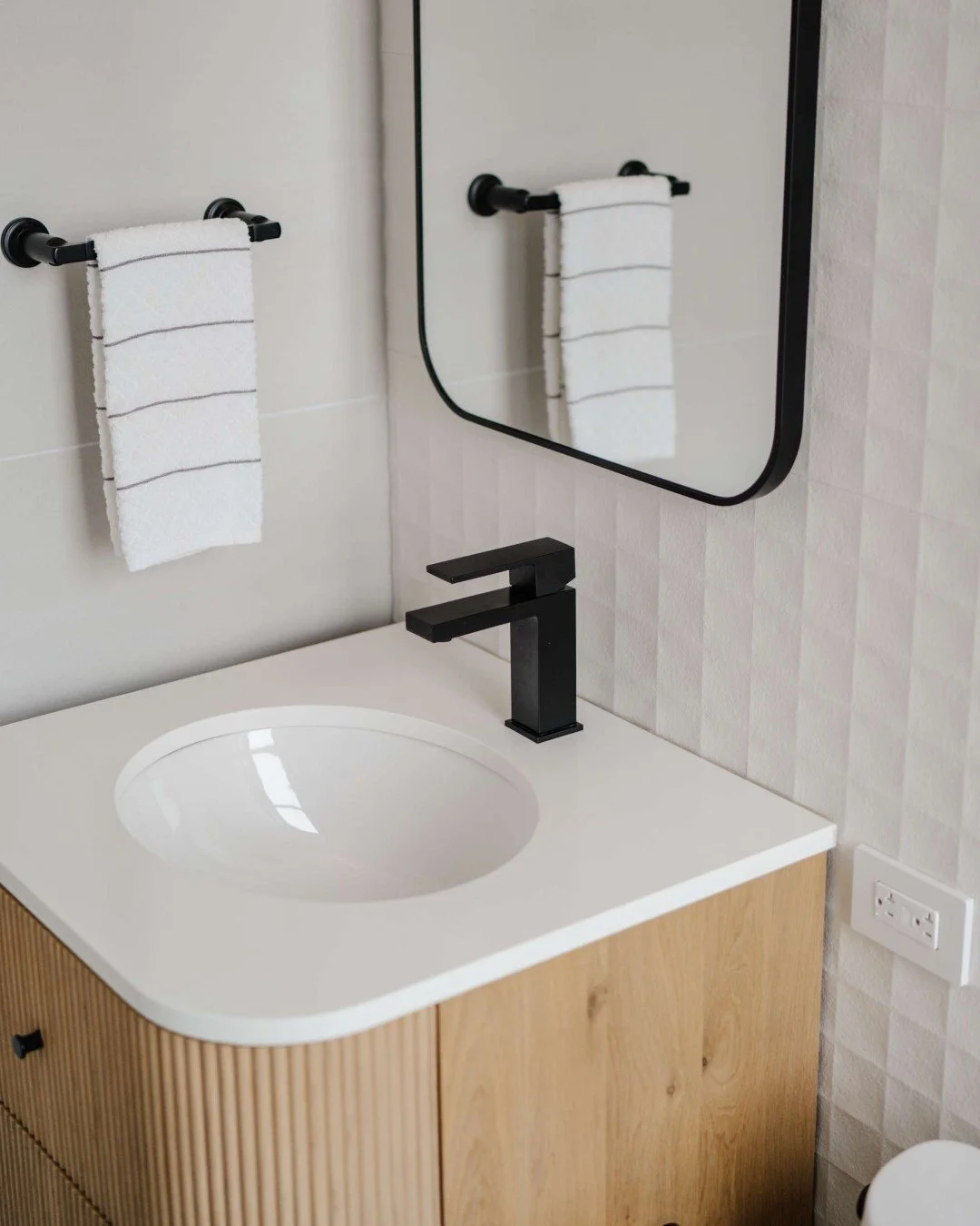 Quietly striking and full of character. ✨

For this guest bathroom, we selected Nemo Tile + Stone&rsquo;s Mood Wall 12x36 White Kalahari Matte to create a space that feels fresh and refined without bold colors or busy patterns. The aligned reliefs ad