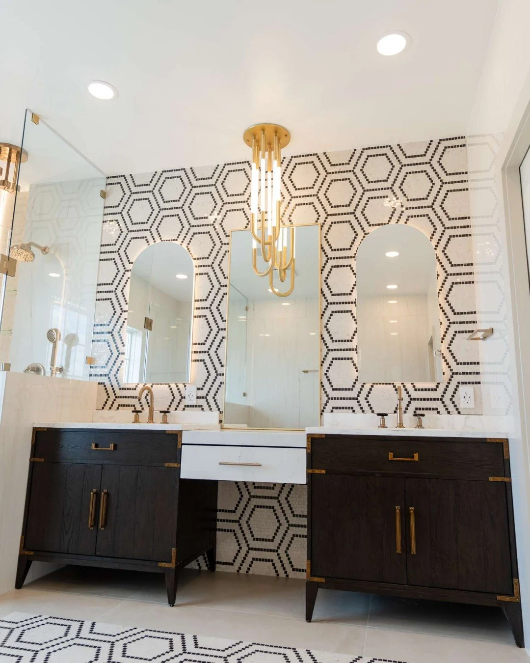 We love taking store-bought pieces and transforming them into something truly one-of-a-kind

For this project, we started with two vanities from Restoration Hardware and added a custom makeup area to seamlessly connect them, creating a unique, cohesi