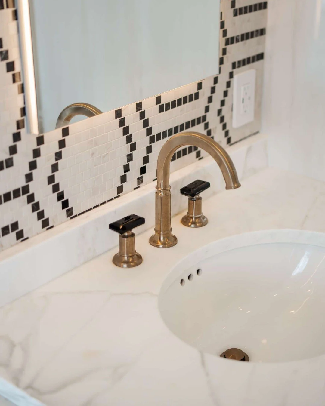 When specifying a faucet for a client, details MATTER.

The Brizo Invari&reg; Lavatory Faucet in luxe gold with black crystal knobs strikes a perfect balance between timeless elegance and modern restraint. Its Edwardian-inspired silhouette honors tra