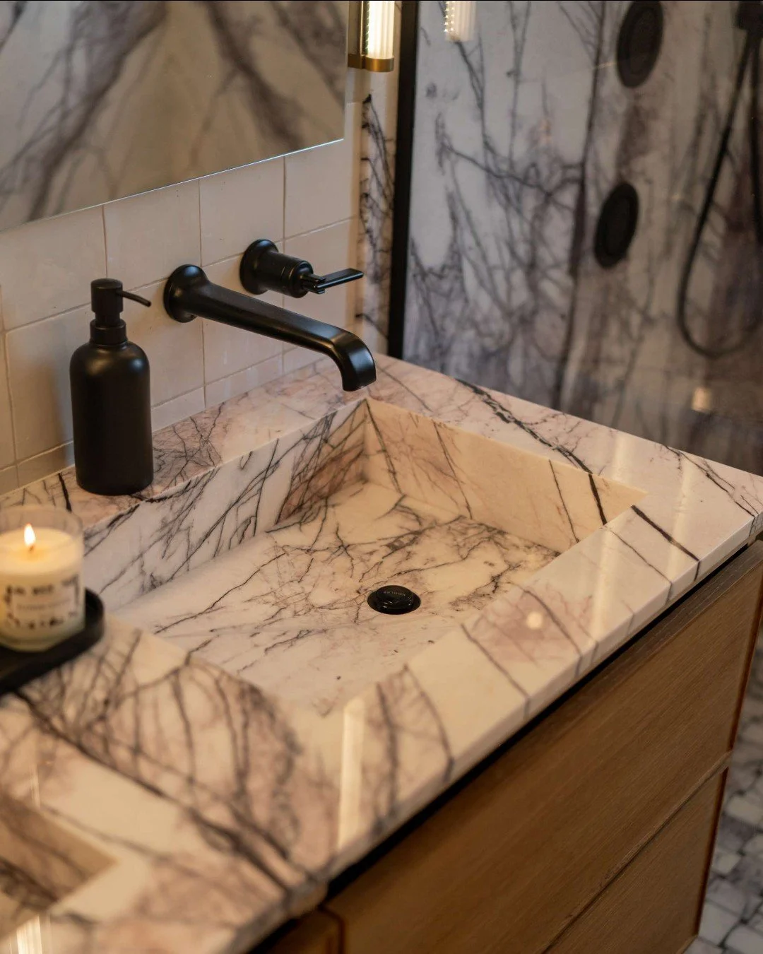 To keep the bathroom feeling connected, we carried the Lilac Marble straight through to the double vanity.

Using the same stone ties the shower and vanity together in a really natural way, and the integrated marble sinks take it one step further&mda
