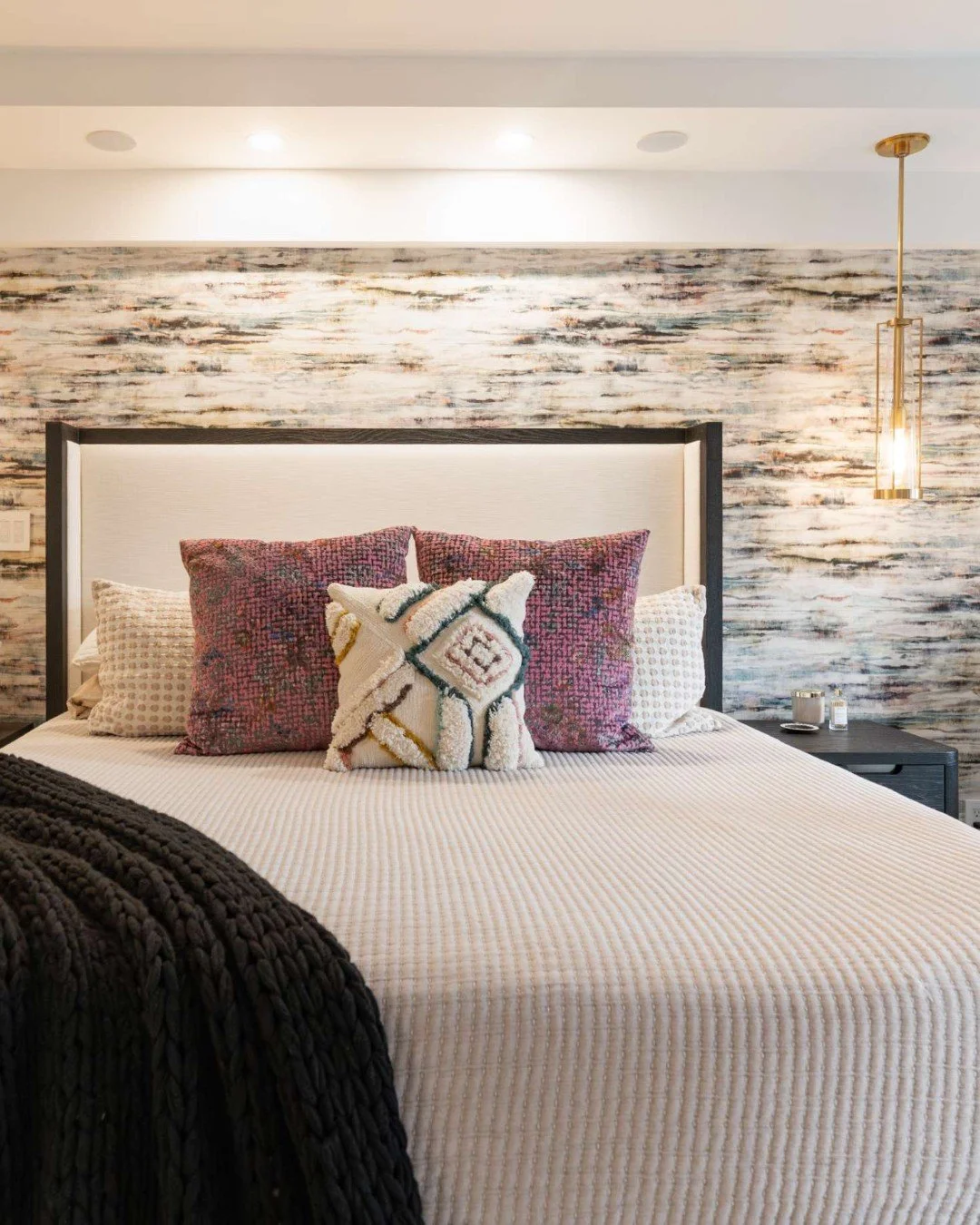 A wallpaper accent wall behind the headboard is one of our favorite ways to add personality without overwhelming the room. It frames the bed, creates a natural focal point, and brings in pattern and texture while still keeping the space calm and rest
