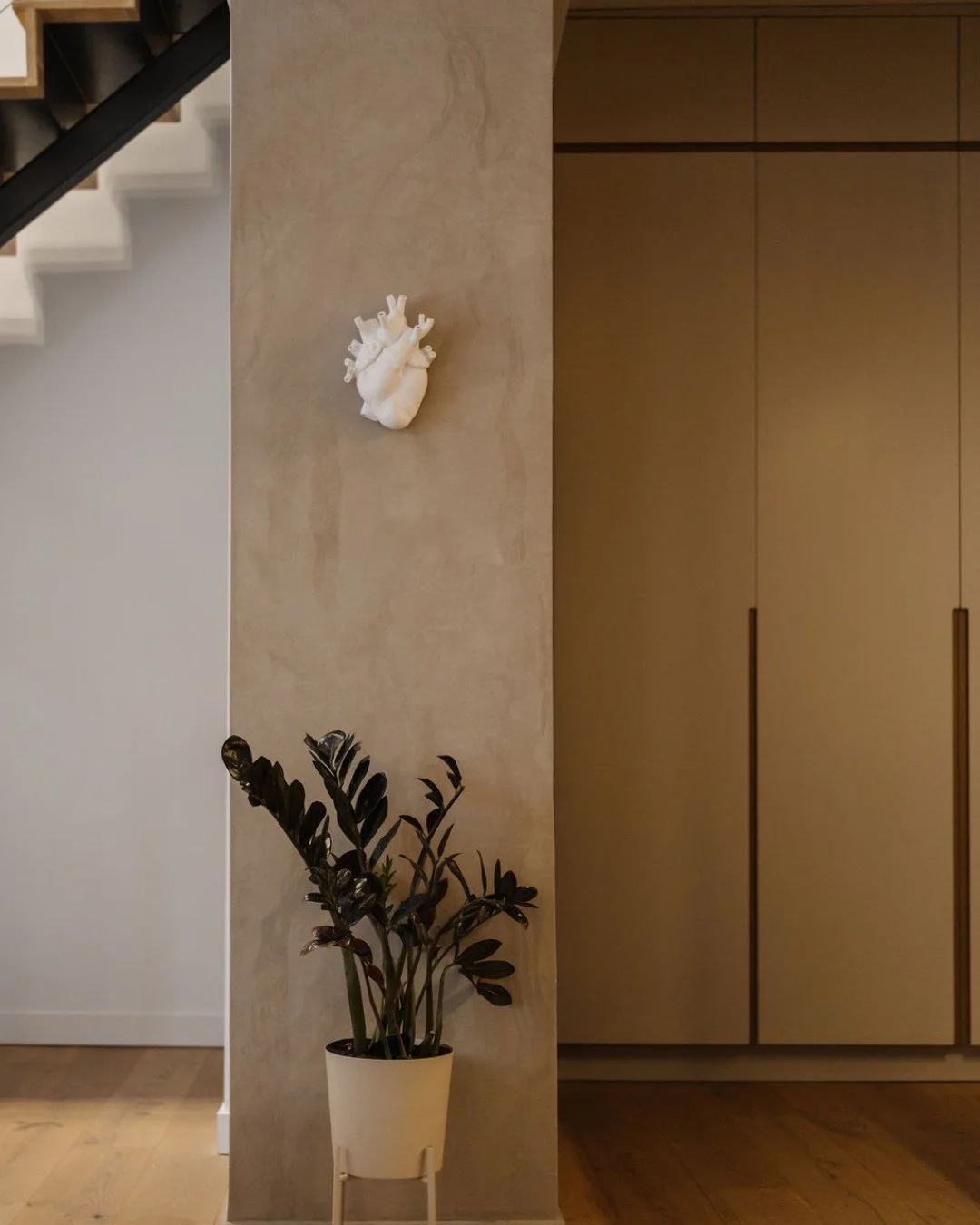 Not even a column is left undesigned. ✨

This structural element in the heart of the home needed more than just functionality&mdash;it needed intention. We applied a faux concrete finish, introducing another layer of organic texture while connecting 