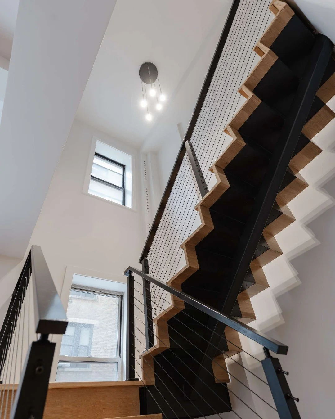 What a transformation this staircase underwent! ✨

Although the changes are subtle, the new railing and squared-off landing completely shift the feel&mdash;bringing a modern, industrial edge while turning the staircase into a true focal point. What o