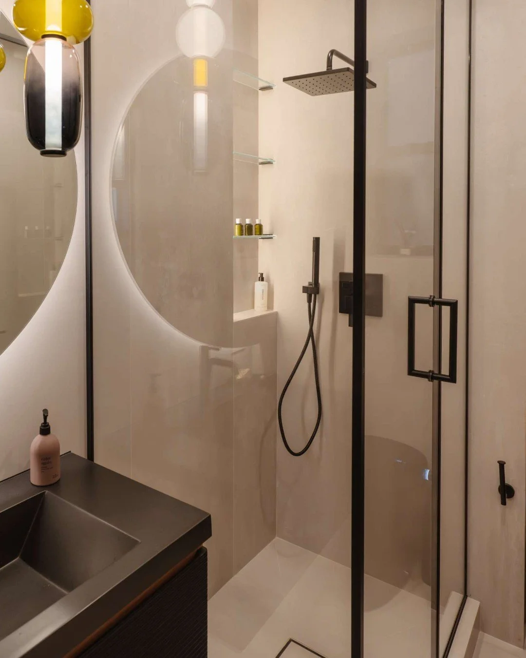 In this guest bath, every detail is designed to feel seamless&mdash;and the shower is no exception.

Envisioned as a glass jewel box, the shower integrates effortlessly into the space. By continuing the same large-format tile throughout, we eliminate