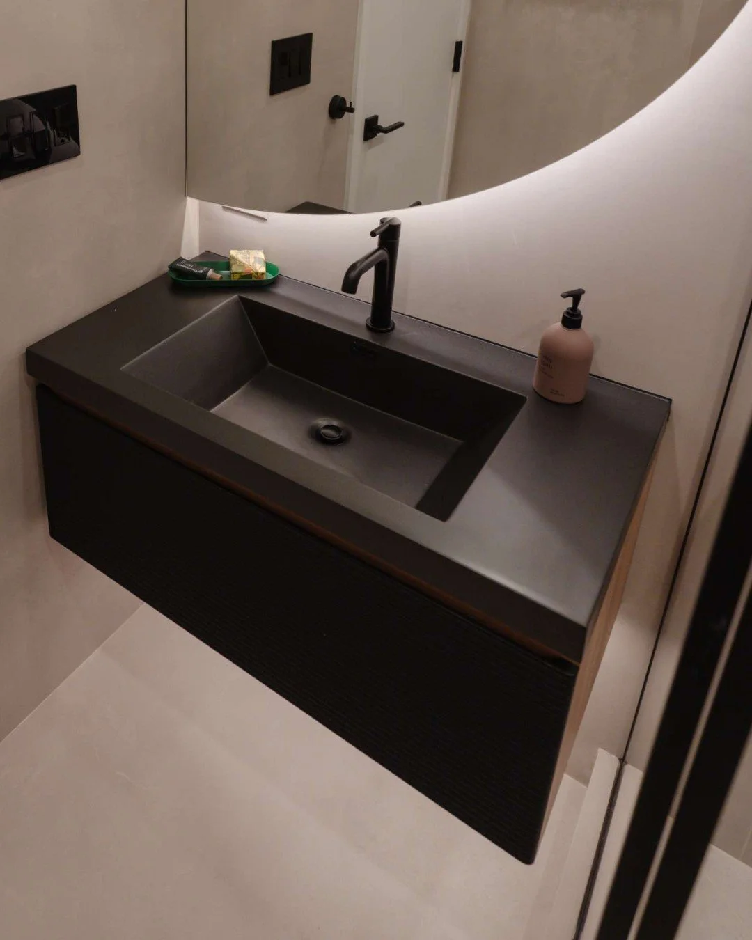 In a guest bath, storage still matters&mdash;but it doesn&rsquo;t need to dominate the design.

Instead of a full floor-mounted vanity with maximum cabinetry, we opted for a wall-mounted floating vanity with a single, streamlined drawer for essential