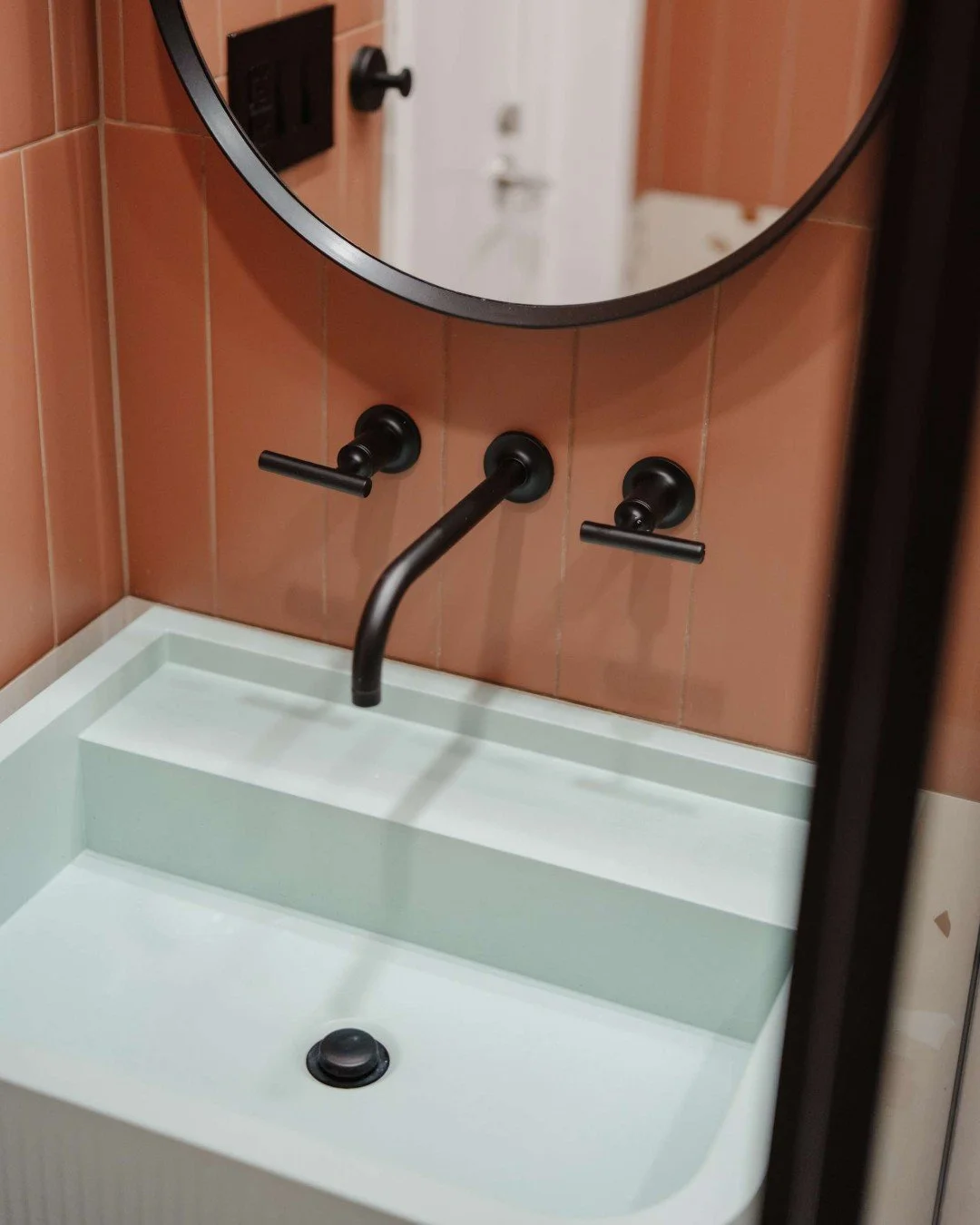 A little unexpected color can completely shift a space 

In this kids&rsquo; bathroom, we layered warm terracotta tones and terrazzo stone to create an earthy, grounded backdrop&mdash;so bringing in the Rue sink from Kast in mint felt like the perfec