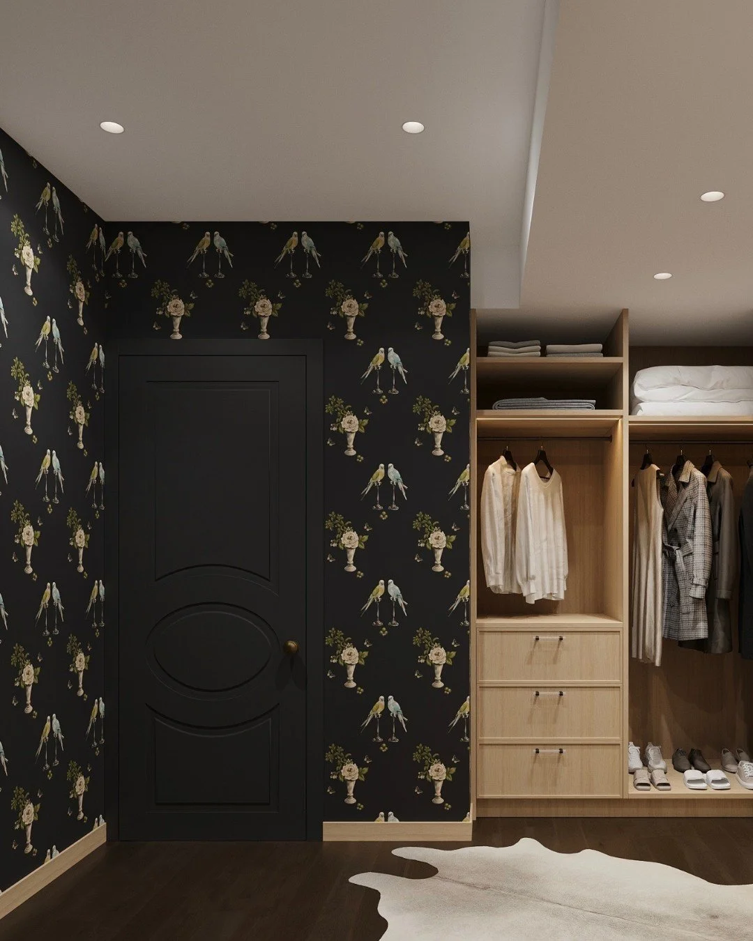 This custom closet design began, quite literally, with the wallpaper.

The client fell in love with this bold black wallcovering&mdash;striking in its contrast yet unexpectedly balanced in its detailing, where birds and floral arrangements bring a so