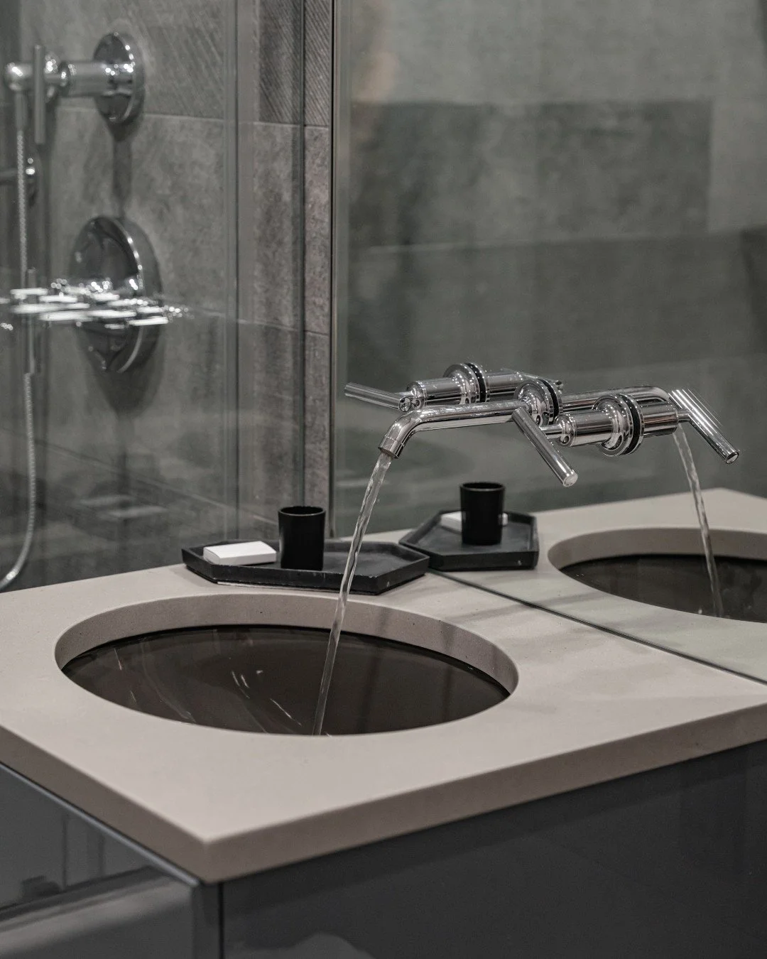 Grey, but never flat.

In this bathroom, layered graphite tones and richly textured surfaces transform grey into something deeply dimensional. The Gordon Graphite textured wall tile introduces subtle surface variation that adds depth and quiet moveme