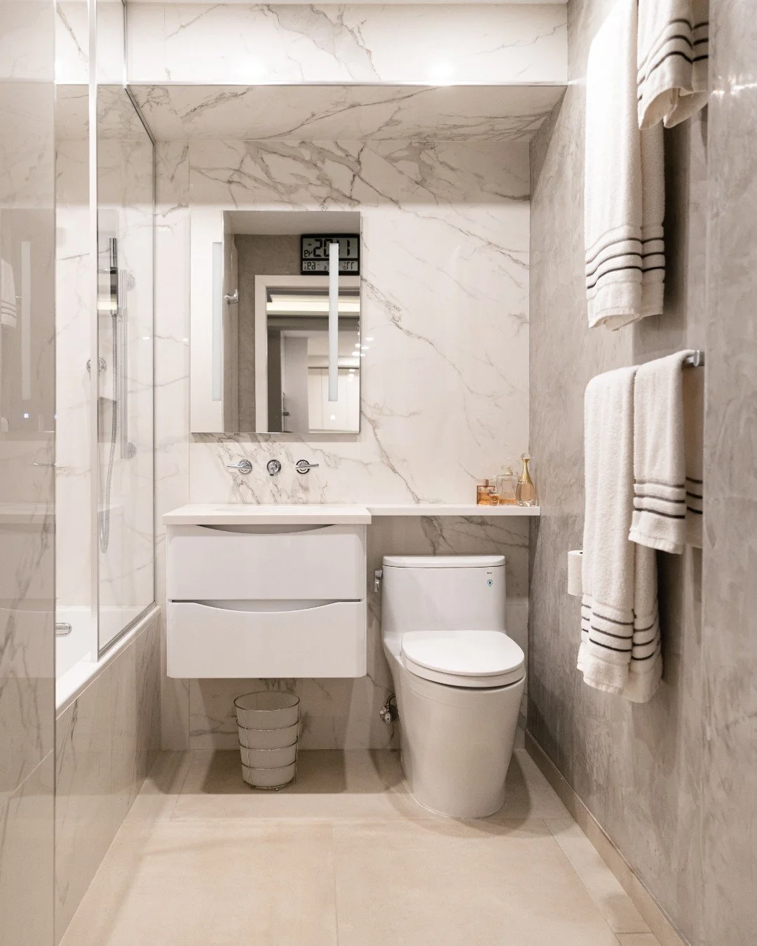 One thing we always try to avoid in bathroom design is having the space feel too cold or one-dimensional&mdash;especially when working with grey tones.

For this bathroom, we leaned into layering materials with similar undertones to create a space th