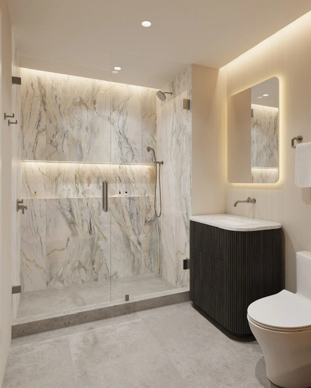 We love when a single design element ties an entire space together 😍

In this bathroom, that element is the large-format porcelain tile wrapping the shower surround. The movement, texture, and subtle veining create a stunning focal point, while the 