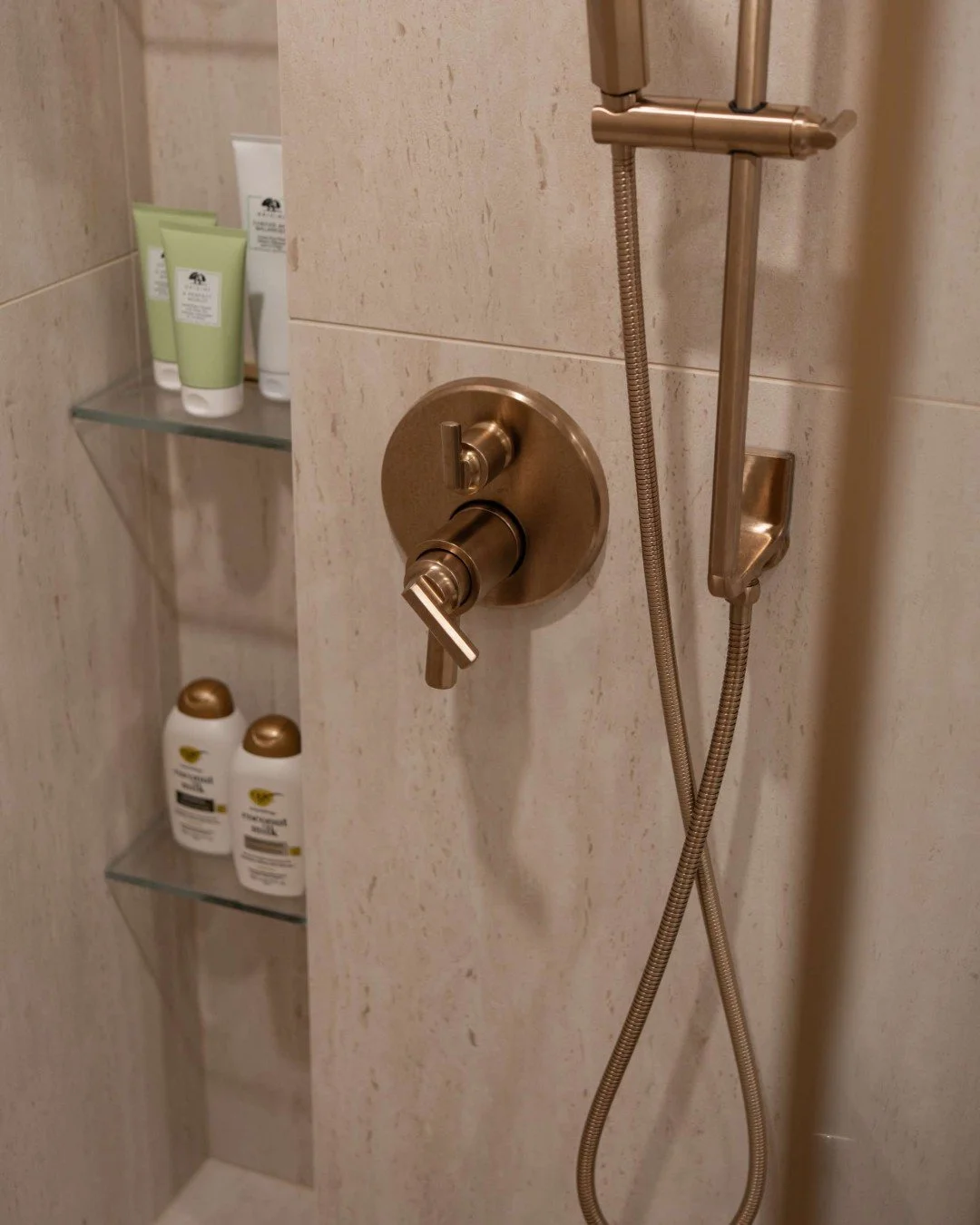 A shower niche should do more than hold your shampoo. ✨

We love designing full-height vertical niches that keep all of your body products, potions, and accoutrements organized and within easy reach. Then, by adding a concealed LED cove light along t