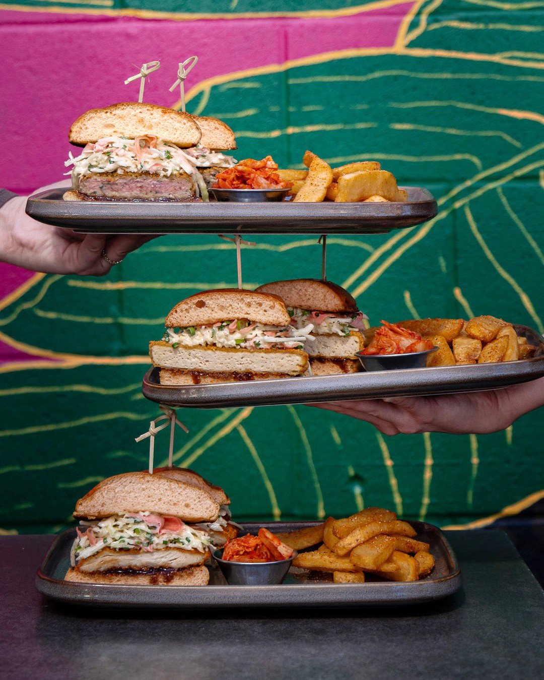 How do you katsu? 🥪
Tofu, chicken, or lamb &ndash; all panko-fried crispy with kewpie slaw &amp; oki sauce on a soft brioche bun.
Served with umami fries &amp; kimchi 🍟😋
Available for lunch Mon-Fri 11am-3pm ✨
#tofukatsu #lambkatsu #chickenkatsu #k