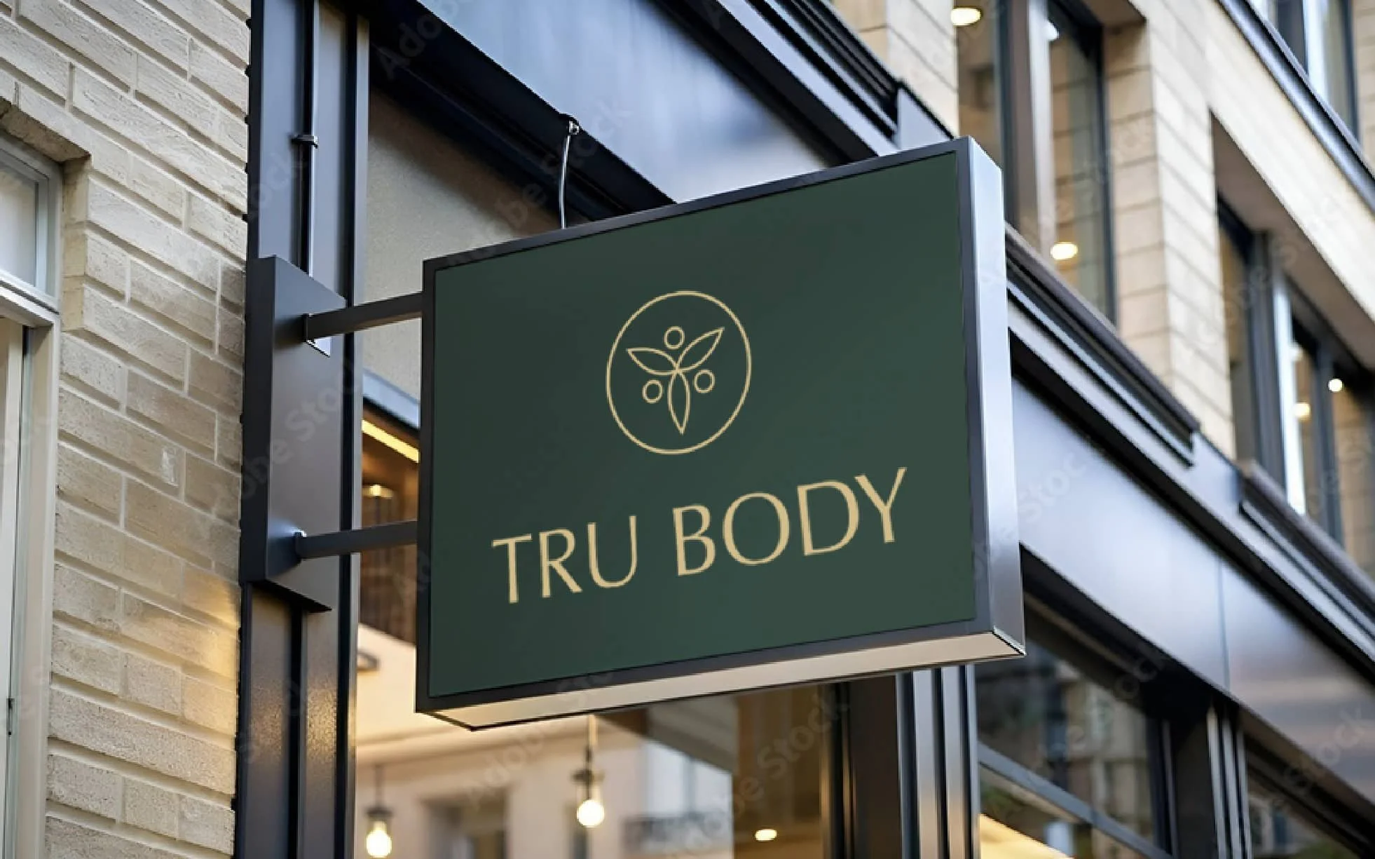 Tru Body storefront sign with gold botanical logo on a green background