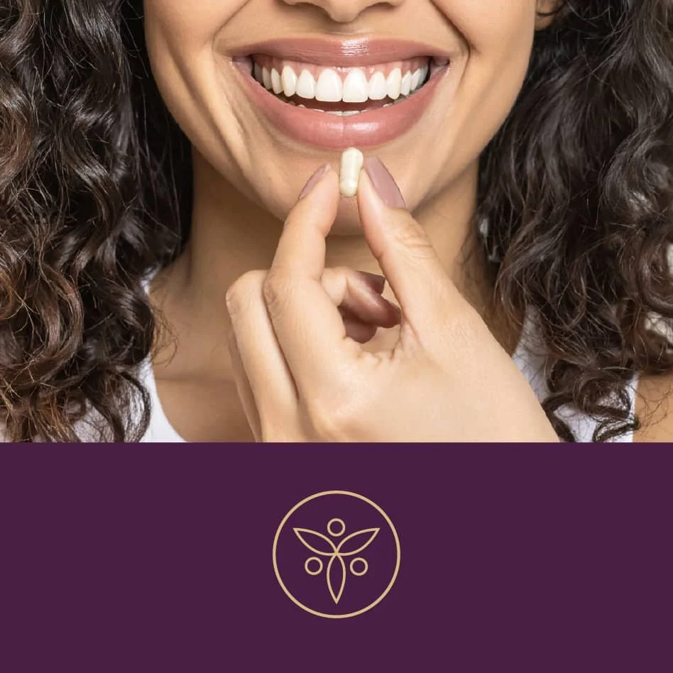 Woman smiling and holding a supplement capsule near her mouth with a wellness brand icon below