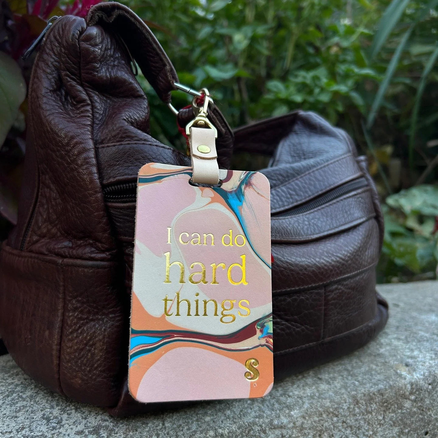 Say hello to the &ldquo;I Can Do Hard Things&rdquo; Bag Tag &mdash; a small but mighty reminder of your capacity to hold, to grow, and to keep showing up. 💪✨
Created in collaboration with Glad &amp; Young Studio, a women-owned leather studio in Atla