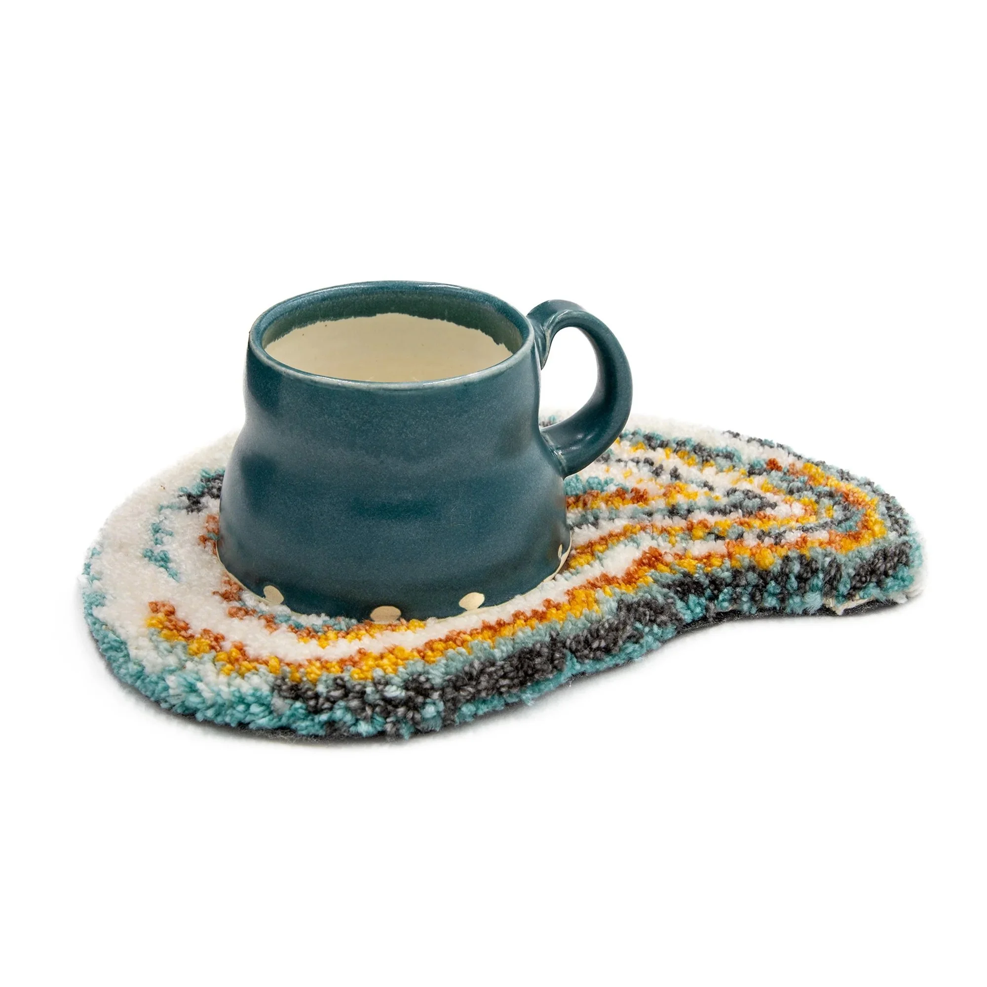 Mug Rug I |
2023 |
Porcelain, Glaze, Yarn, Textiles