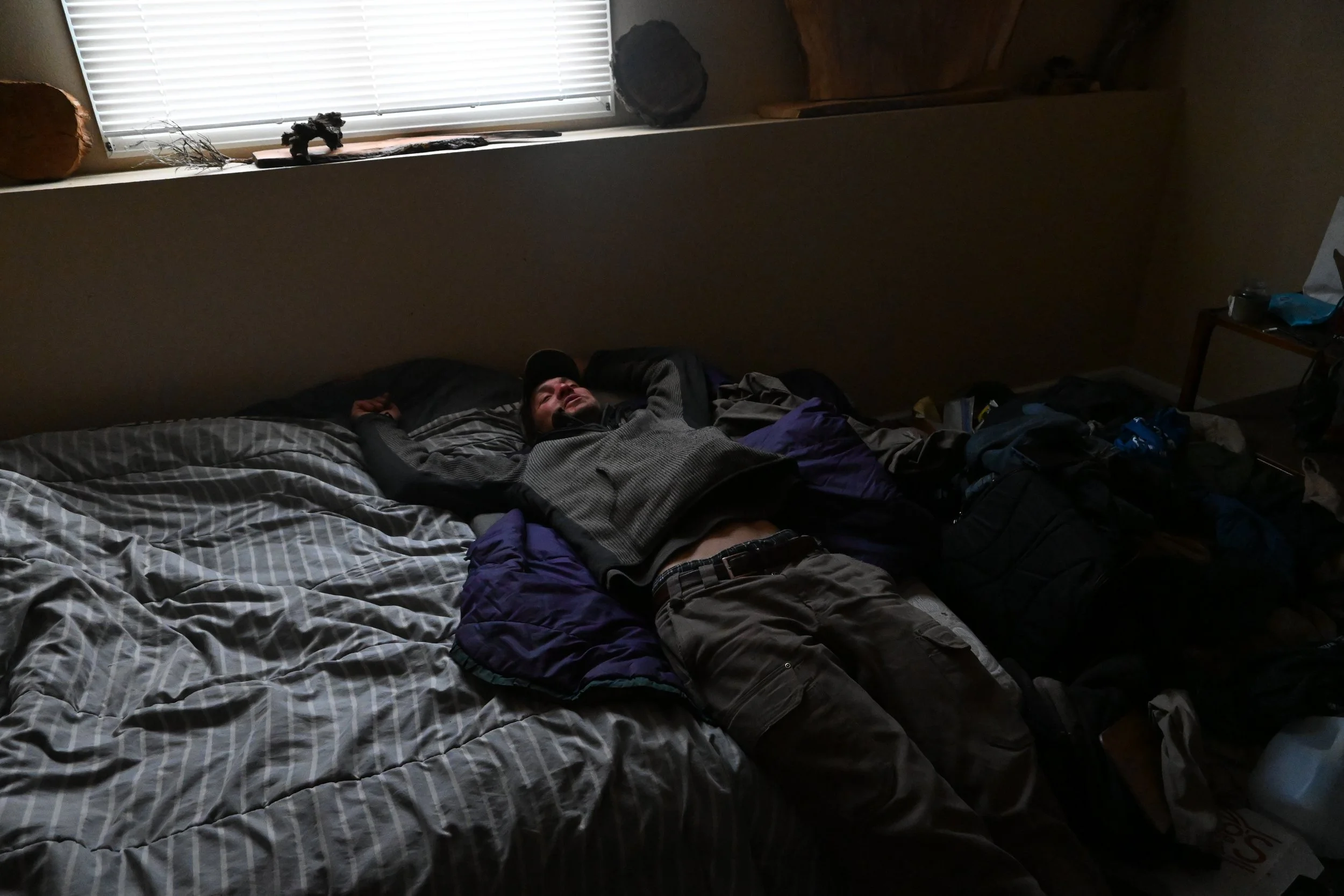 Randall Sorensen lays in his bed, trying to mentally prep for the day. He did not sleep the night before. (Photo by Colette Czarnecki)