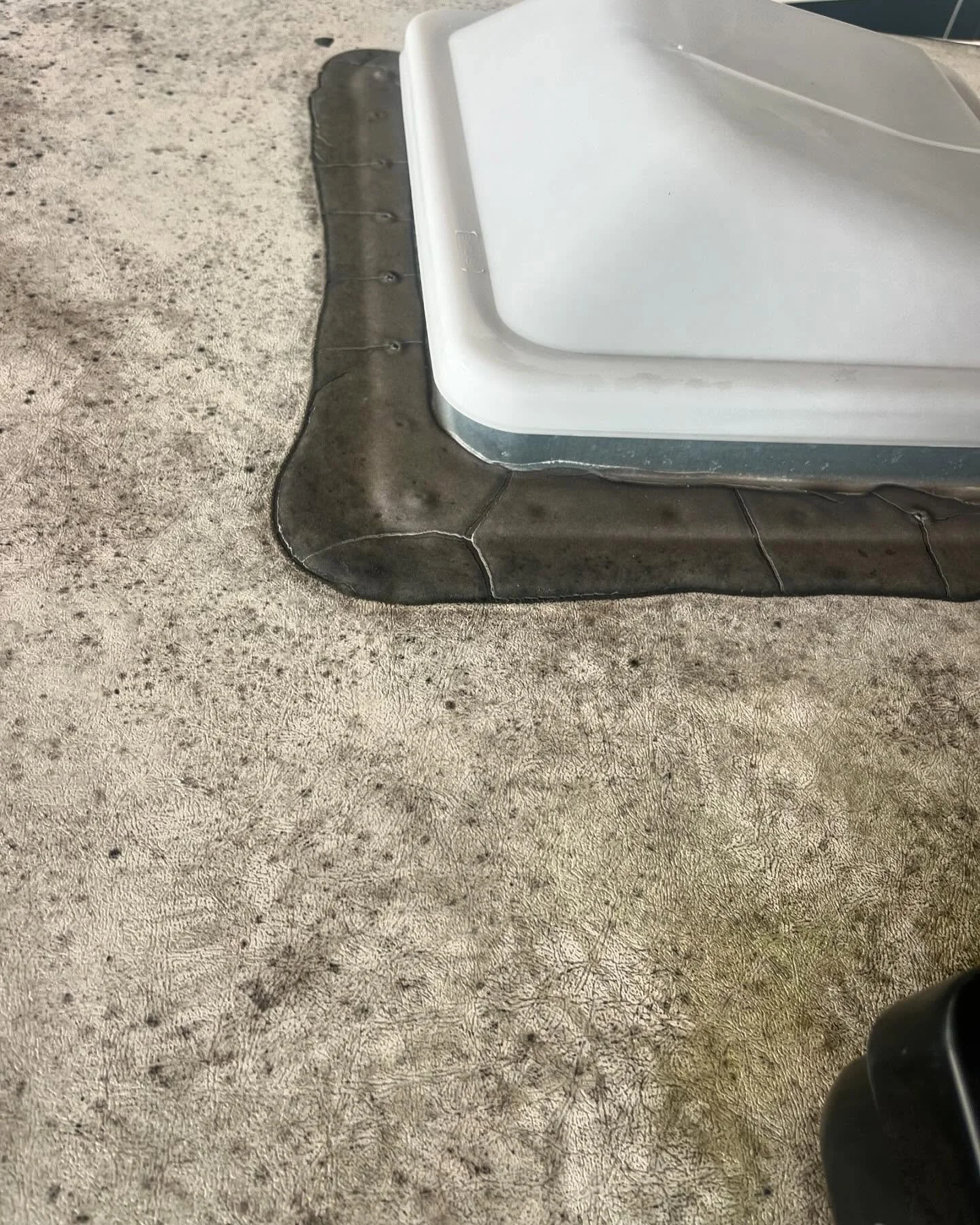 If your RV roof sealant looks like this, it&rsquo;s time for a reseal. We remove old sealant, clean the area and apply new. I like to start with the seams and penetration points, then lay my ribbon over top within a couple minutes. This is John&rsquo