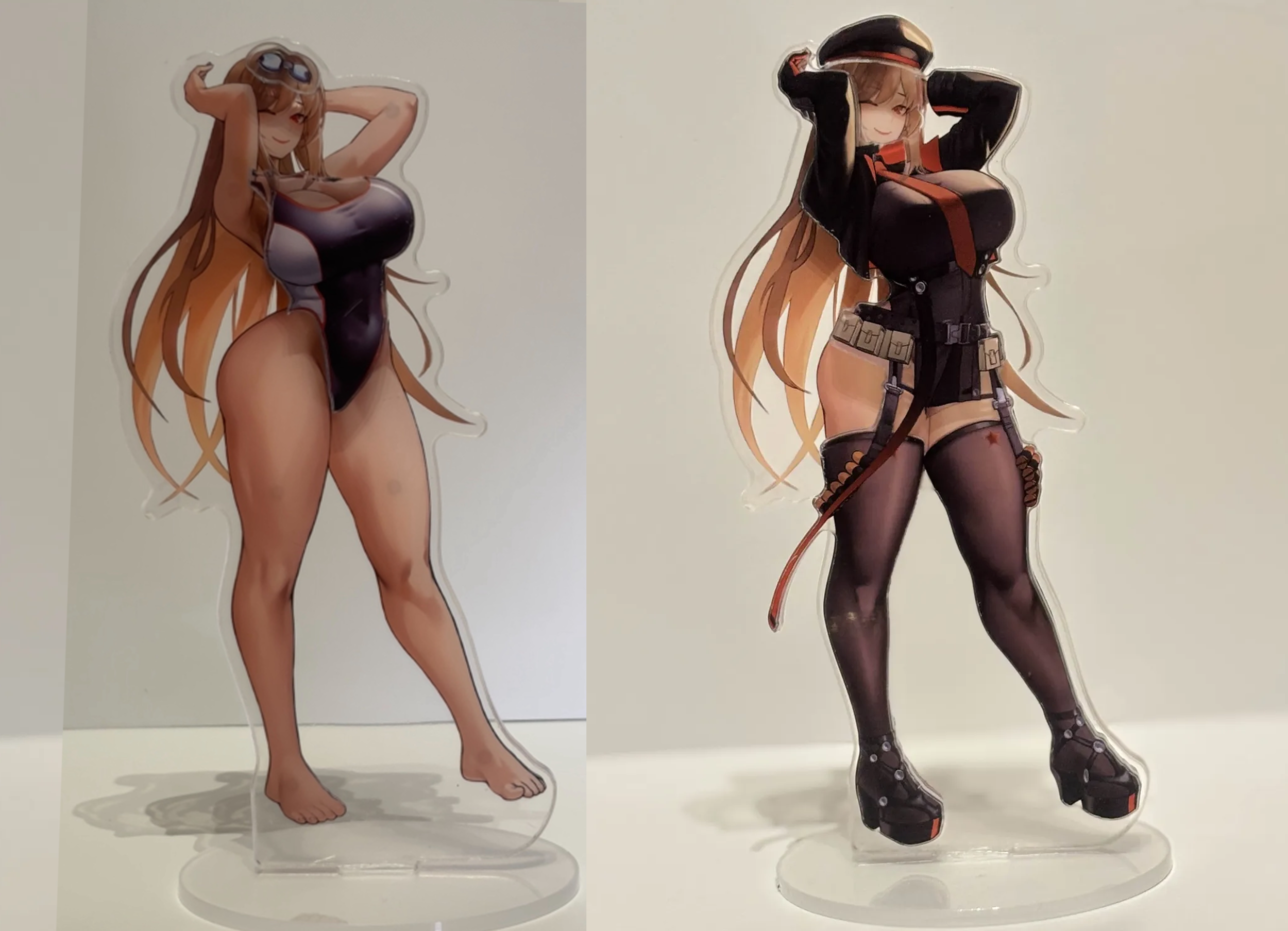 Two anime-style character standees, one in a black swimsuit with glasses, and the other in a military-inspired outfit with a hat and thigh-high stockings.