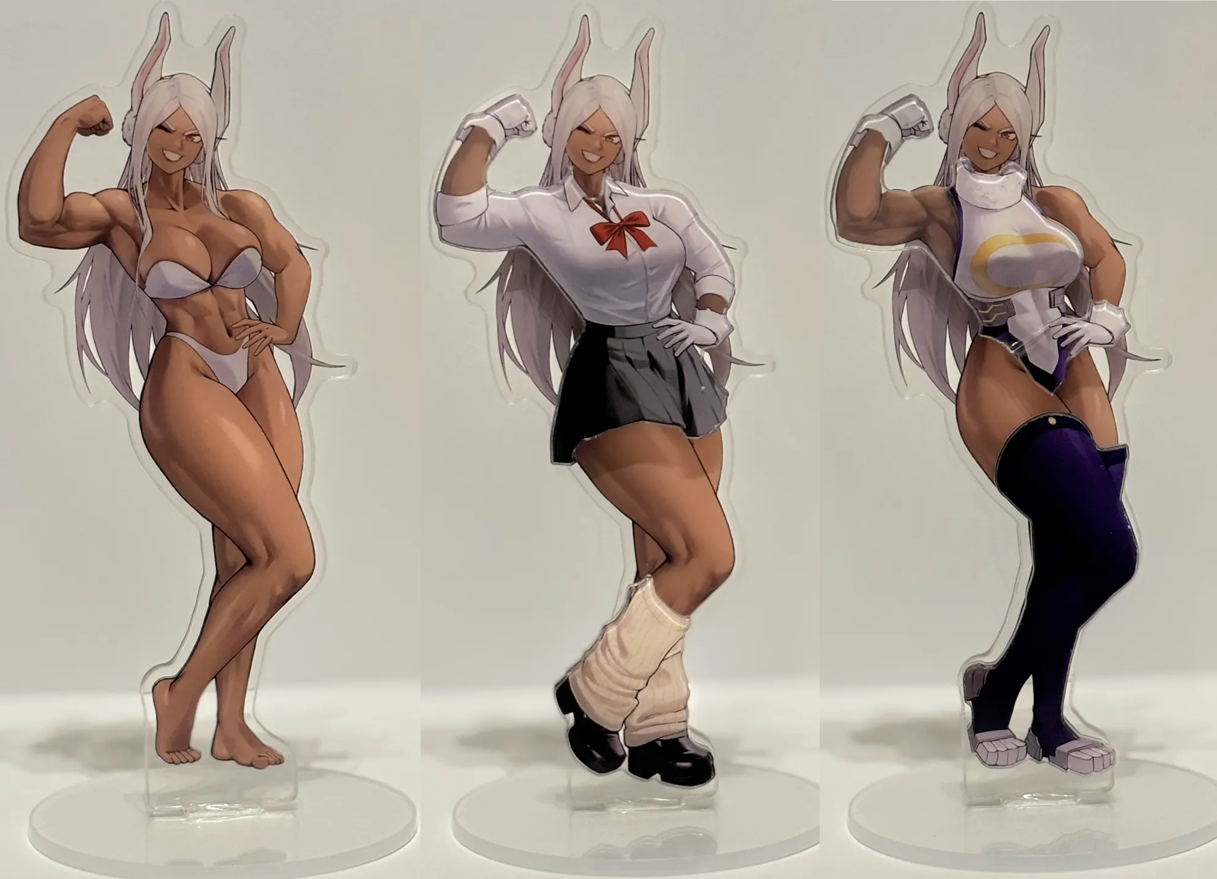 Three anime-style female characters with white hair and bunny ears, each with a different outfit and pose, on clear oval stands.